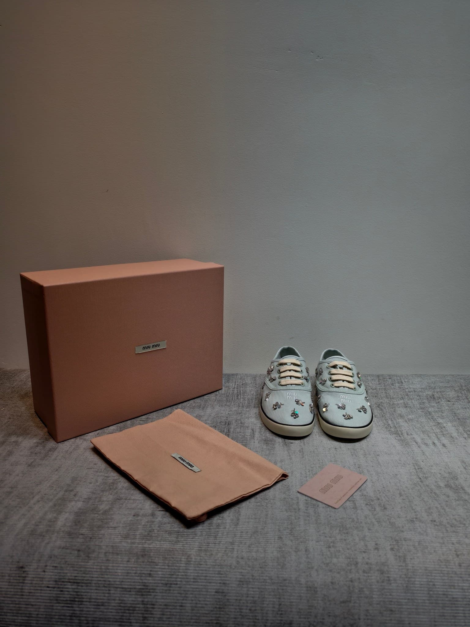 D10641 MIUMIU 2026 new model. The upper is made of twill canvas (textile material) with a textile lining. The sole is made of rubber with the brand logo. The insole is a detachable fabric insole, ensuring comfort and a distinct brand style. Signature “dia — image 1