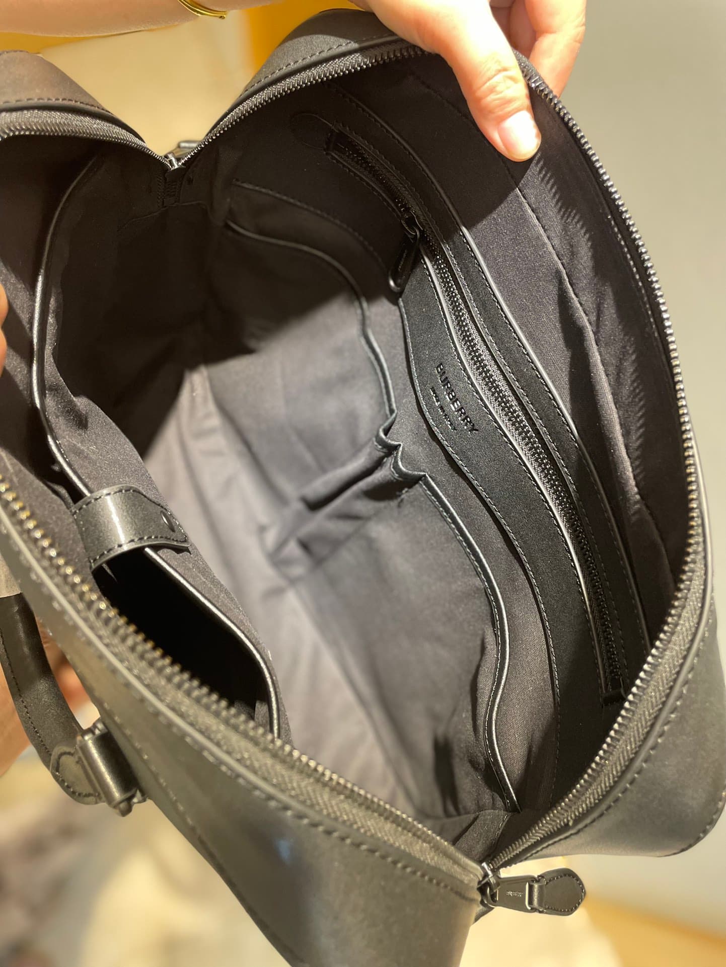 C8232 -B Brand’s latest briefcase is crafted from check pattern and Italian tanned leather, with a branded logo design. It can be carried in a handbag style, or it can be worn on the shoulder using detachable straps. At least 30% of the materials used in  — image 8