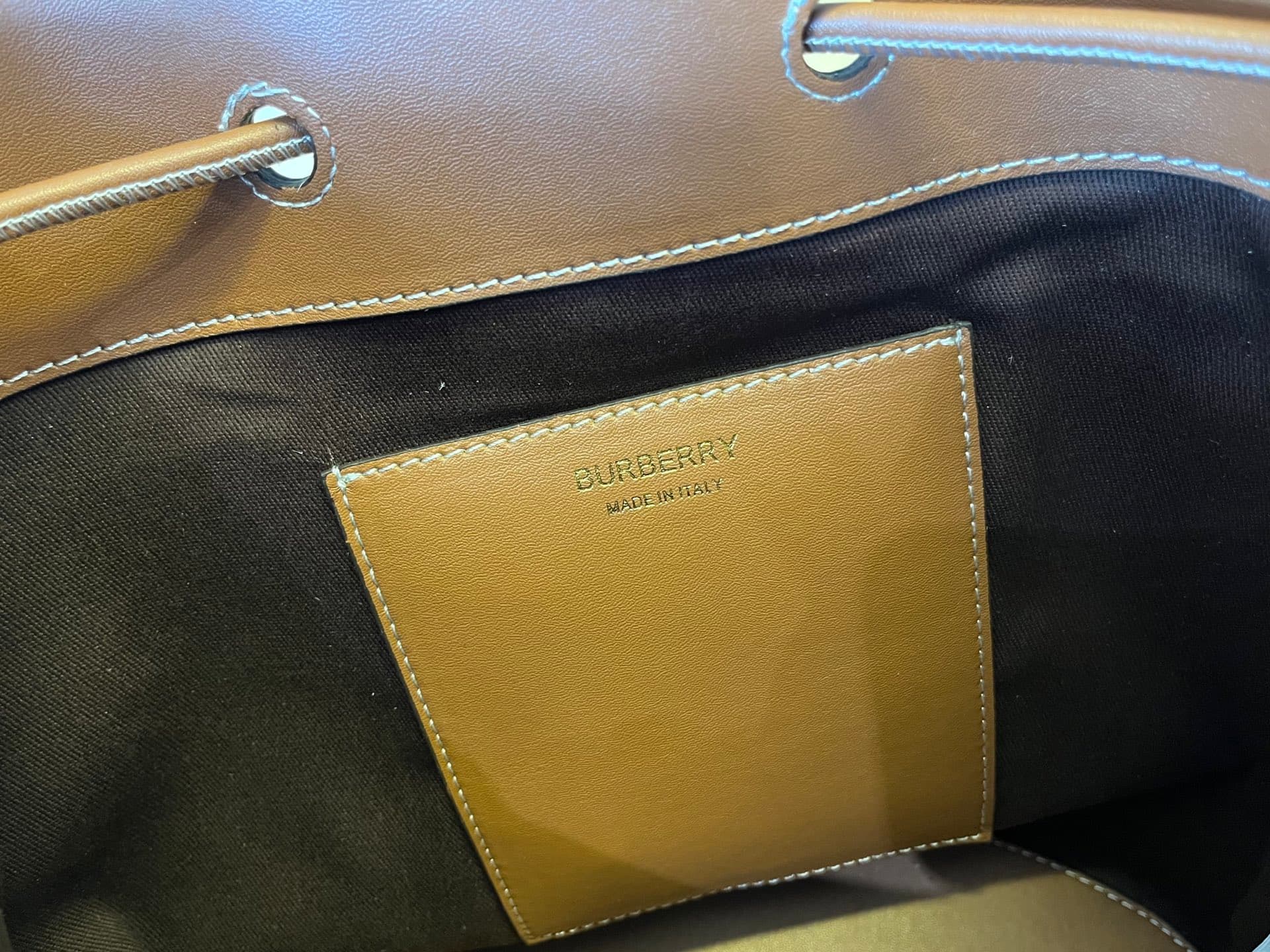 C14 B brand's latest bucket bag, crafted from large-sized patterned and ribbed leather material, adorned with the TB exclusive logo. This bag is a new member of the TB bag collection series, featuring a detachable and adjustable sling shoulder strap, and  — image 8
