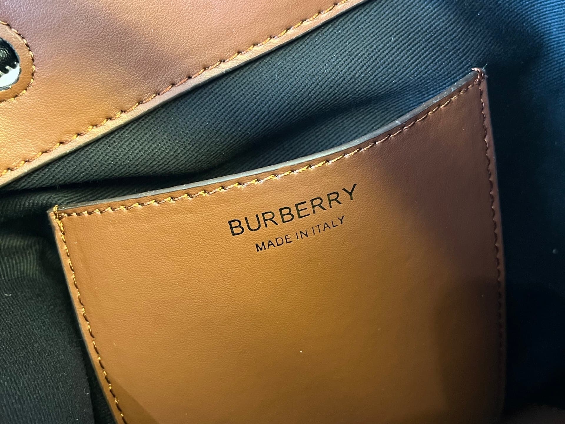 C13 B brand's latest bucket bag, crafted from large-scale check and ribbed leather material, adorned with the TB exclusive logo. This bag is a new member of the TB bag collection, featuring a detachable adjustable diagonal shoulder strap and an inner pock — image 8
