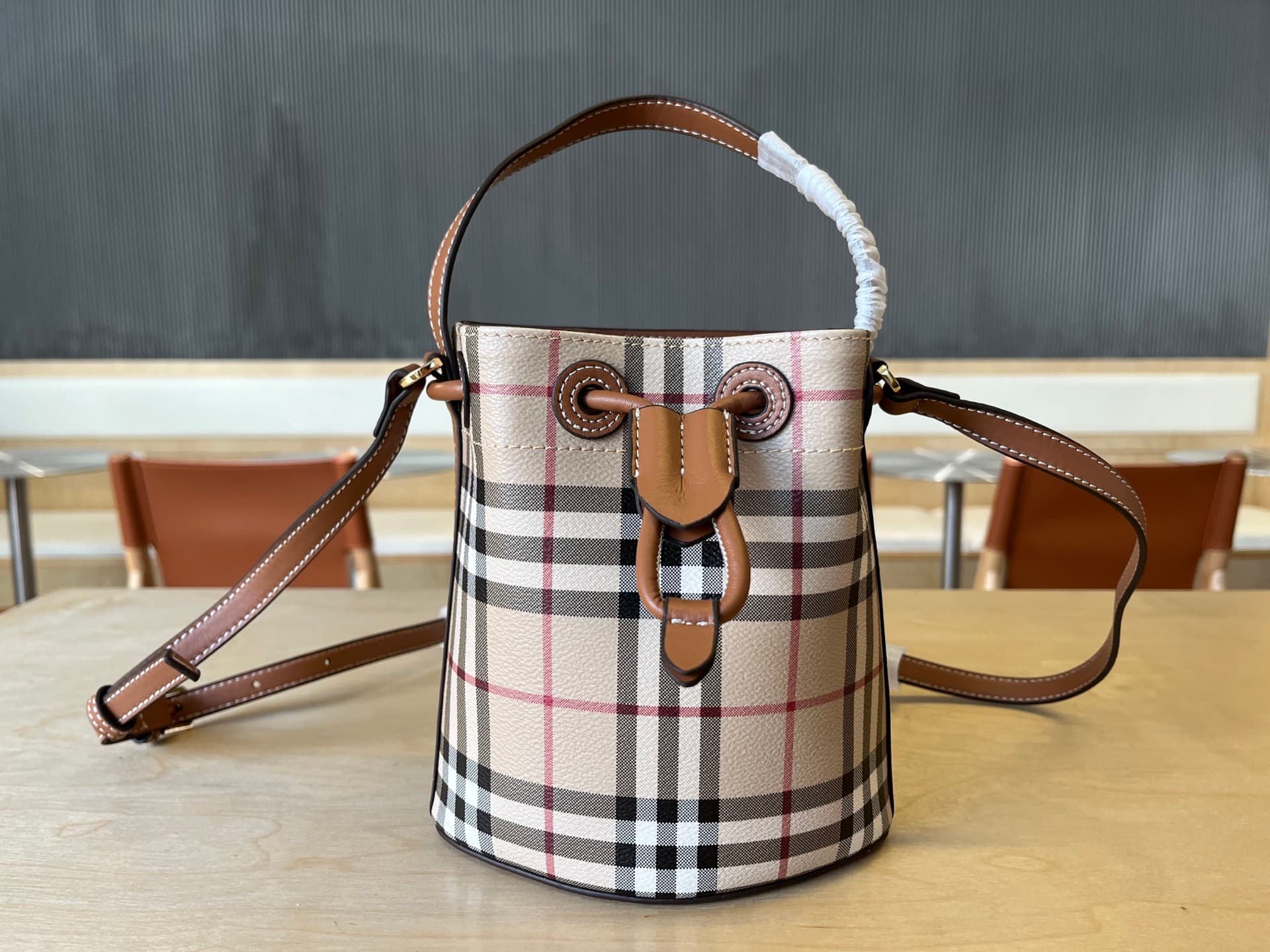 C15 B Brand Mini Bucket Bag with Pins, Vintage/retro Burberry pattern, Italian tanned leather trim and TB exclusive logo. 11, 16.5, 18.5cm detachable adjustable diagonal straps. Adjustable pin closure. Hand-painted lacquered edges. Glossy metal accessorie — image 2