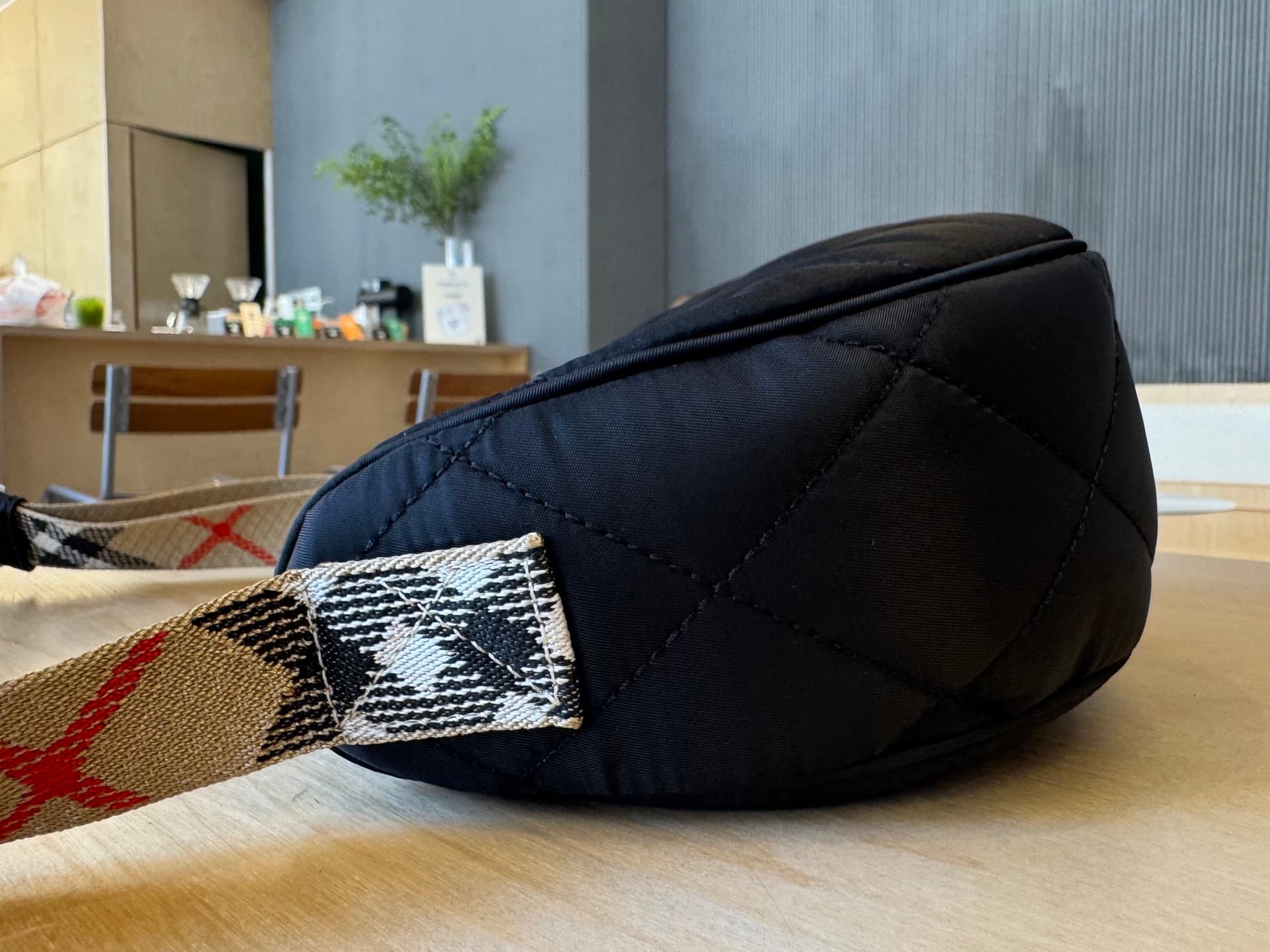 C44 [B’s top-tier original products] Slanted backpack, inspired by the elegance of English countryside. Made from quilted nylon blend fabric, adorned with fine-broken Bur pattern in the new season’s colors. Features leather trim and a knight’s seal in the — image 4
