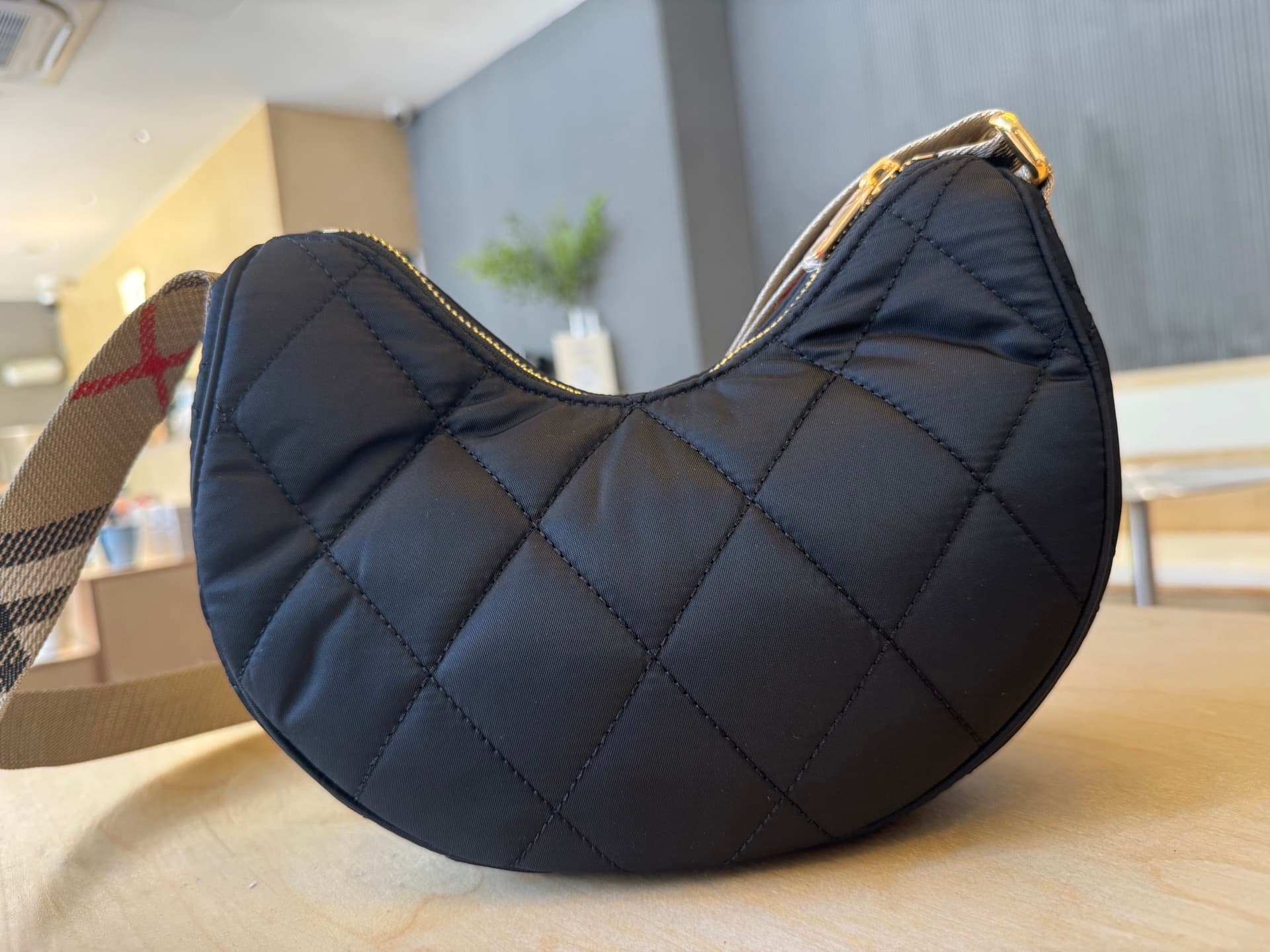 C44 [B’s top-tier original products] Slanted backpack, inspired by the elegance of English countryside. Made from quilted nylon blend fabric, adorned with fine-broken Bur pattern in the new season’s colors. Features leather trim and a knight’s seal in the — image 3