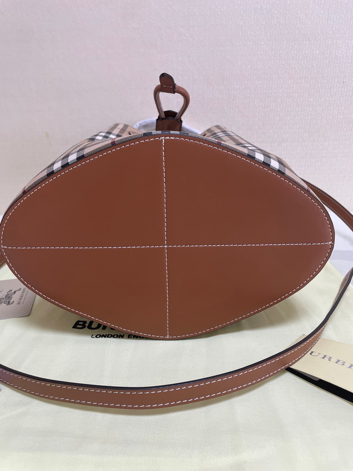 C12 B brand's latest bucket bag, crafted from large vintage/retro checked and glossy thread leather, adorned with the TB exclusive logo. This bag is a new member of the TB bag collection, featuring a detachable adjustable crossbody strap and an inner pock — image 8