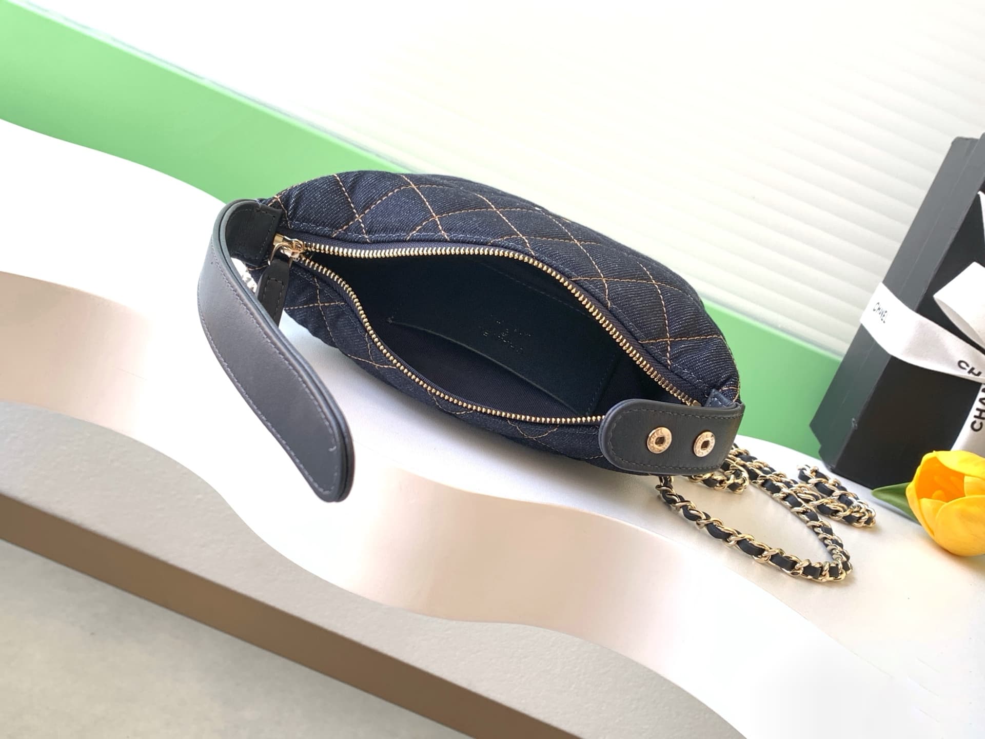 C725 26P Denim lunchbox bag: dark denim fabric with classic diamond pattern design; metal chains and leather straps. It can be carried in hand, over shoulder, or crossbody style. The bag is small and cute in size; it has enough space for a phone, keys, an — image 8