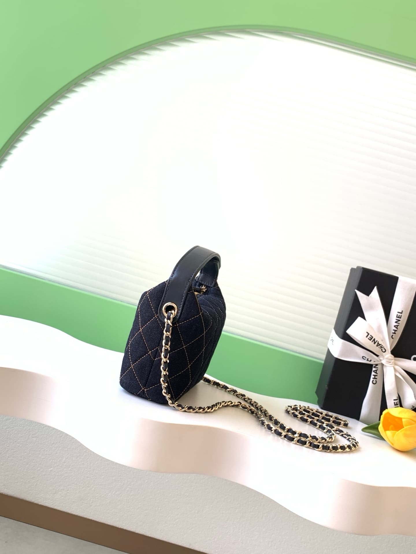 C725 26P Denim lunchbox bag: dark denim fabric with classic diamond pattern design; metal chains and leather straps. It can be carried in hand, over shoulder, or crossbody style. The bag is small and cute in size; it has enough space for a phone, keys, an — image 2