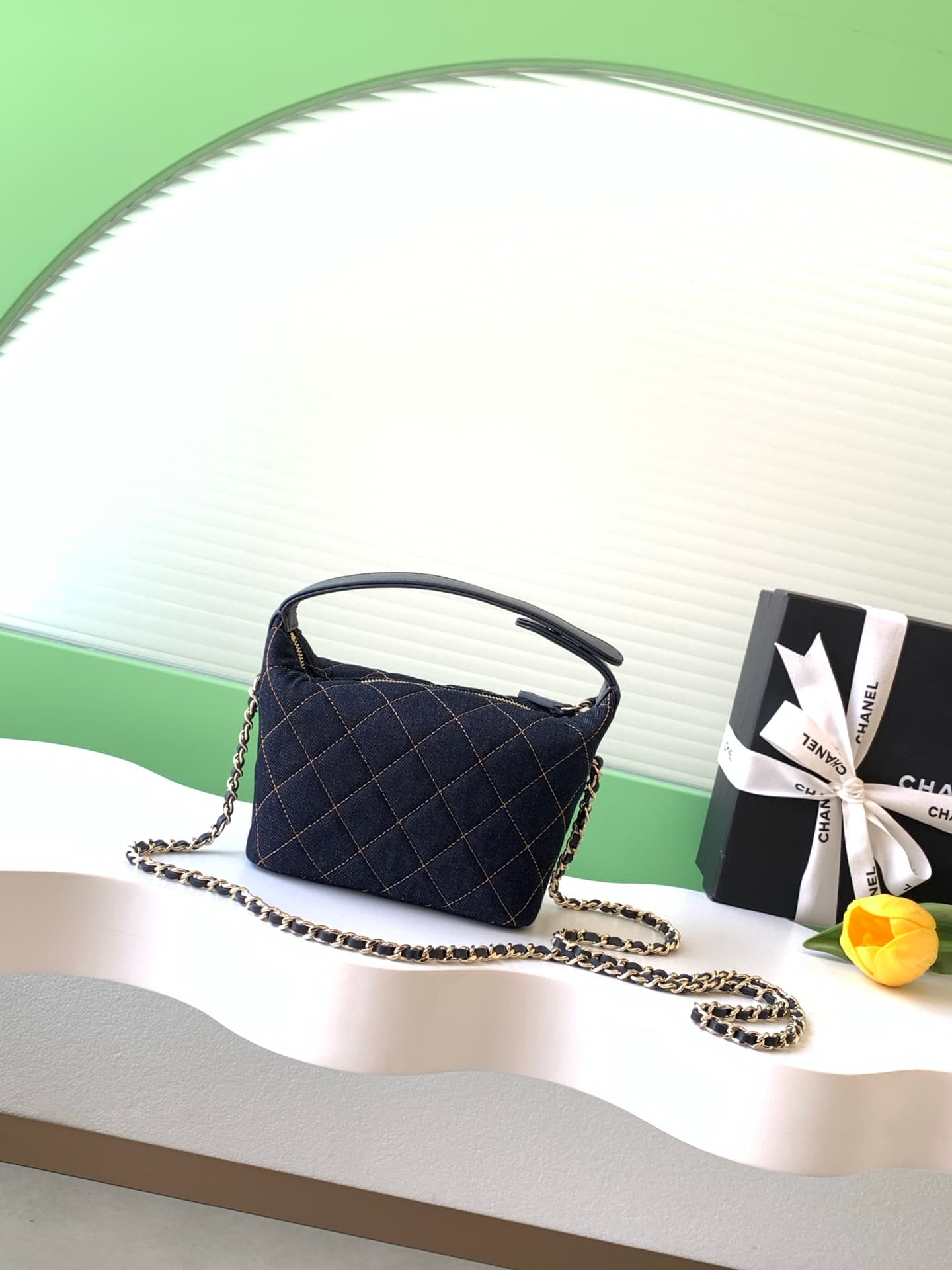 C725 26P Denim lunchbox bag: dark denim fabric with classic diamond pattern design; metal chains and leather straps. It can be carried in hand, over shoulder, or crossbody style. The bag is small and cute in size; it has enough space for a phone, keys, an — image 3