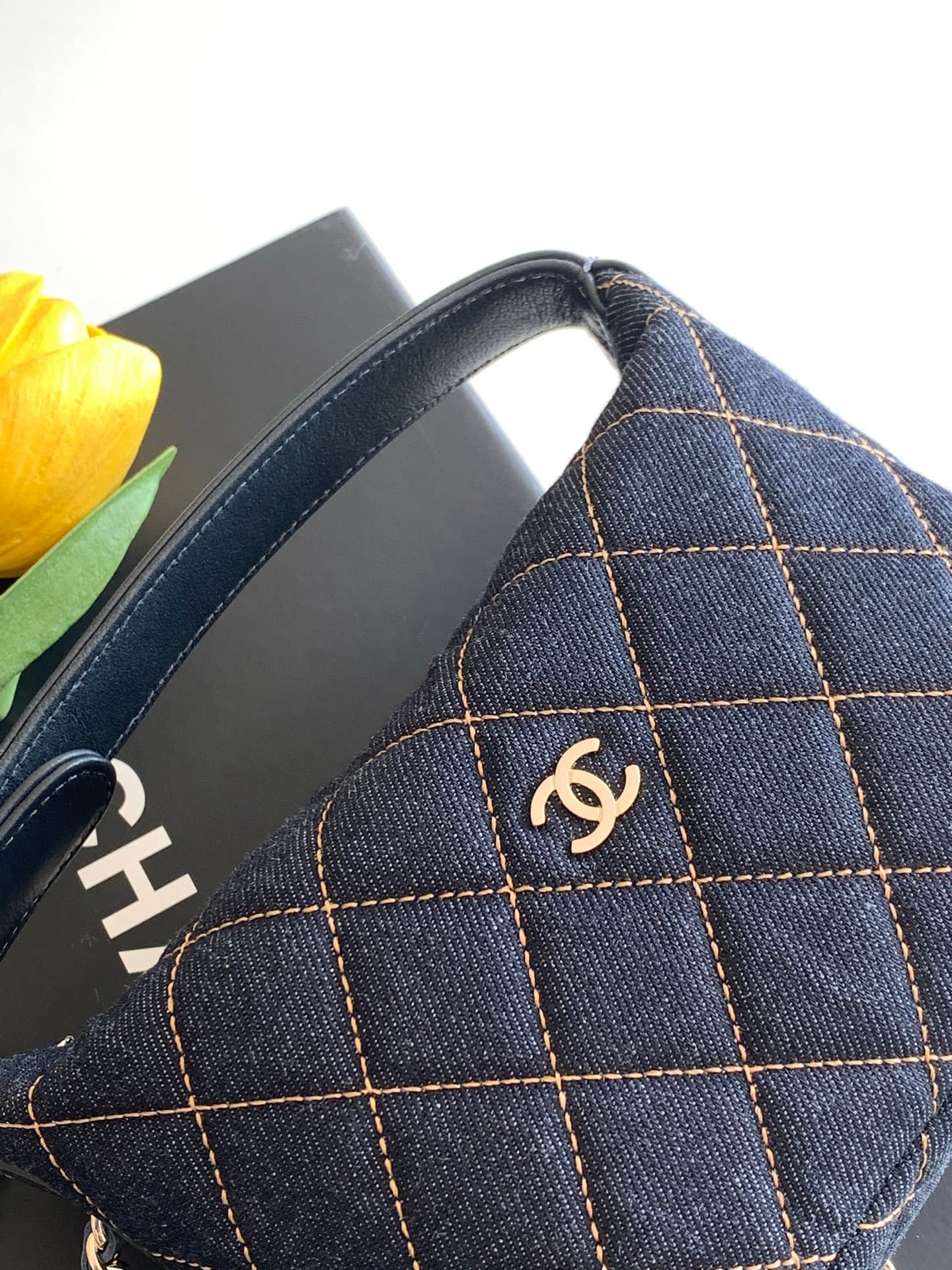 C725 26P Denim lunchbox bag: dark denim fabric with classic diamond pattern design; metal chains and leather straps. It can be carried in hand, over shoulder, or crossbody style. The bag is small and cute in size; it has enough space for a phone, keys, an — image 5