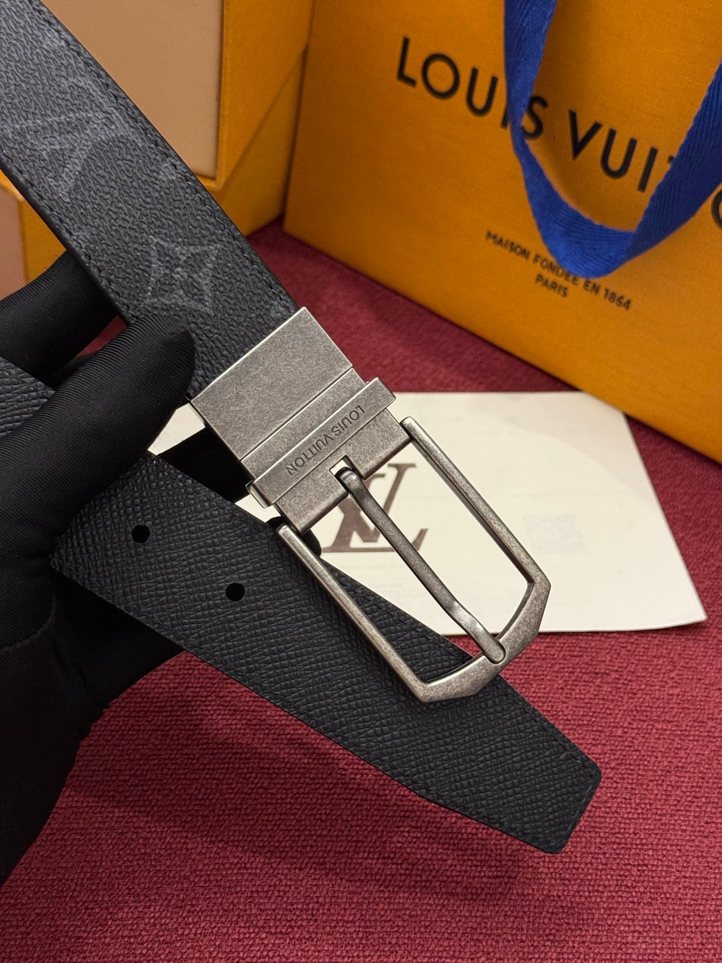 C32955 This Slender double-sided belt features Monogram-coated canvas and leather materials, along with intricate buckles and metal bands adorned with Louis Vuitton logos. — image 4