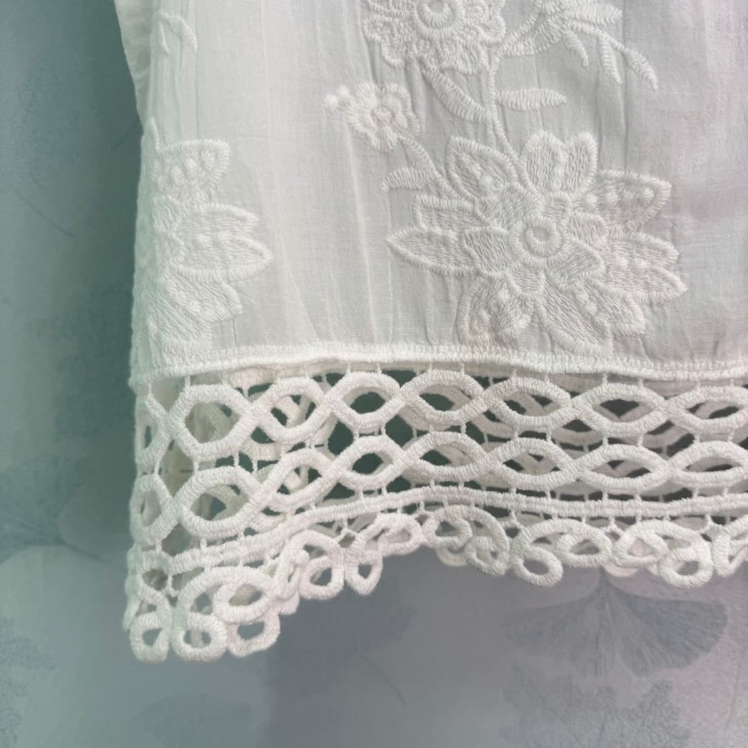 C18451 🆕Ch*26 – New spring/summer white embroidered straps top. Made of a lightweight, breathable fabric, it’s extremely comfortable to wear in summer! Delicate floral embroidery and open-weave hem design; great attention to detail. There are double C sym — image 7