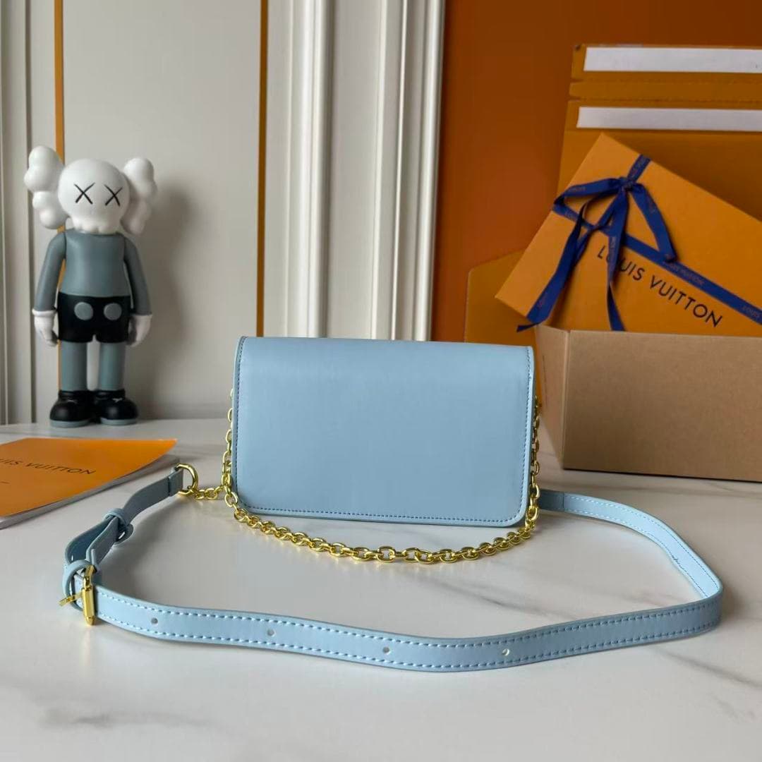 C5243 Upgraded Model   M14564 M14547 M14581 M14548 This Wallet On Chain handbag is part of the LV Bloom series by Louis Vuitton. It features a stylish and functional design crafted from cowhide leather. The iconic Monogram pattern from the brand serves as — image 5