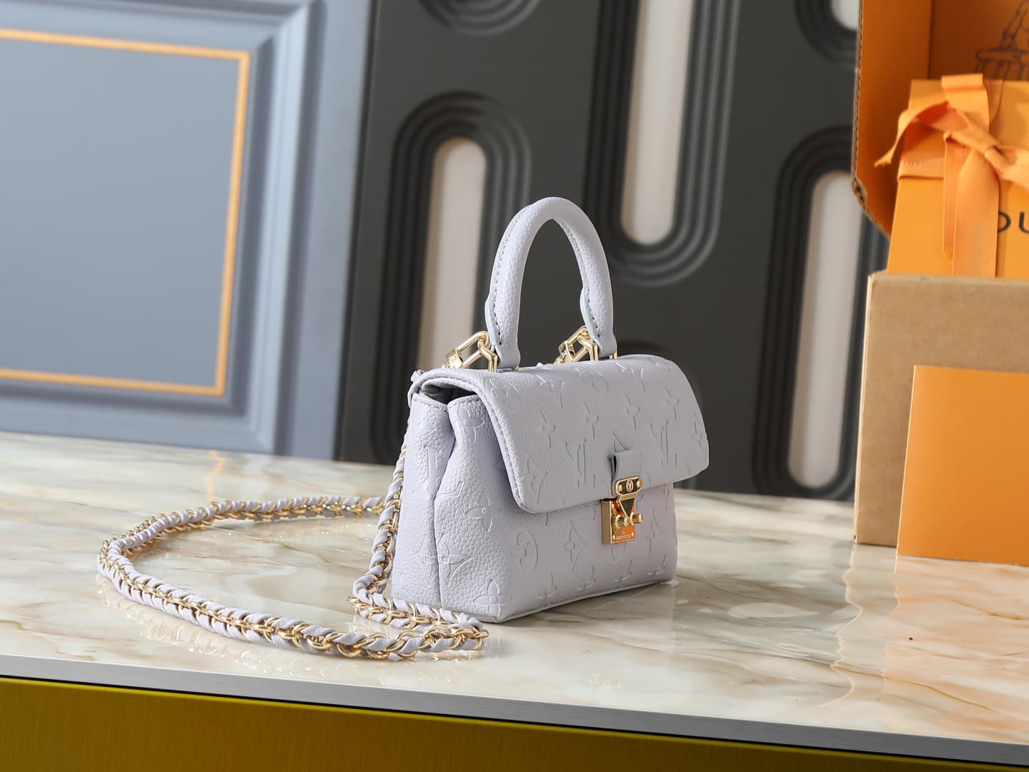 C5151 💰 Upgrade from the original M27034, M25596, M13796, M12145, M12144, and M12211. The Nano Madeleine handbag features a new season of dreamy colors, allowing easy styling in various ways. The classic Monogram Empreinte leather body is paired with the  — image 2