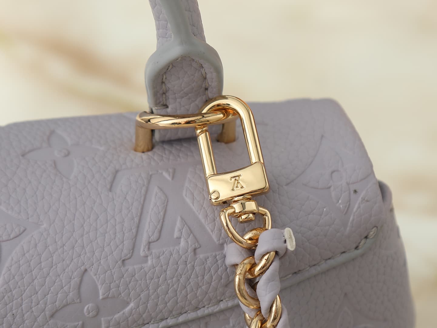 C5151 💰 Upgrade from the original M27034, M25596, M13796, M12145, M12144, and M12211. The Nano Madeleine handbag features a new season of dreamy colors, allowing easy styling in various ways. The classic Monogram Empreinte leather body is paired with the  — image 6