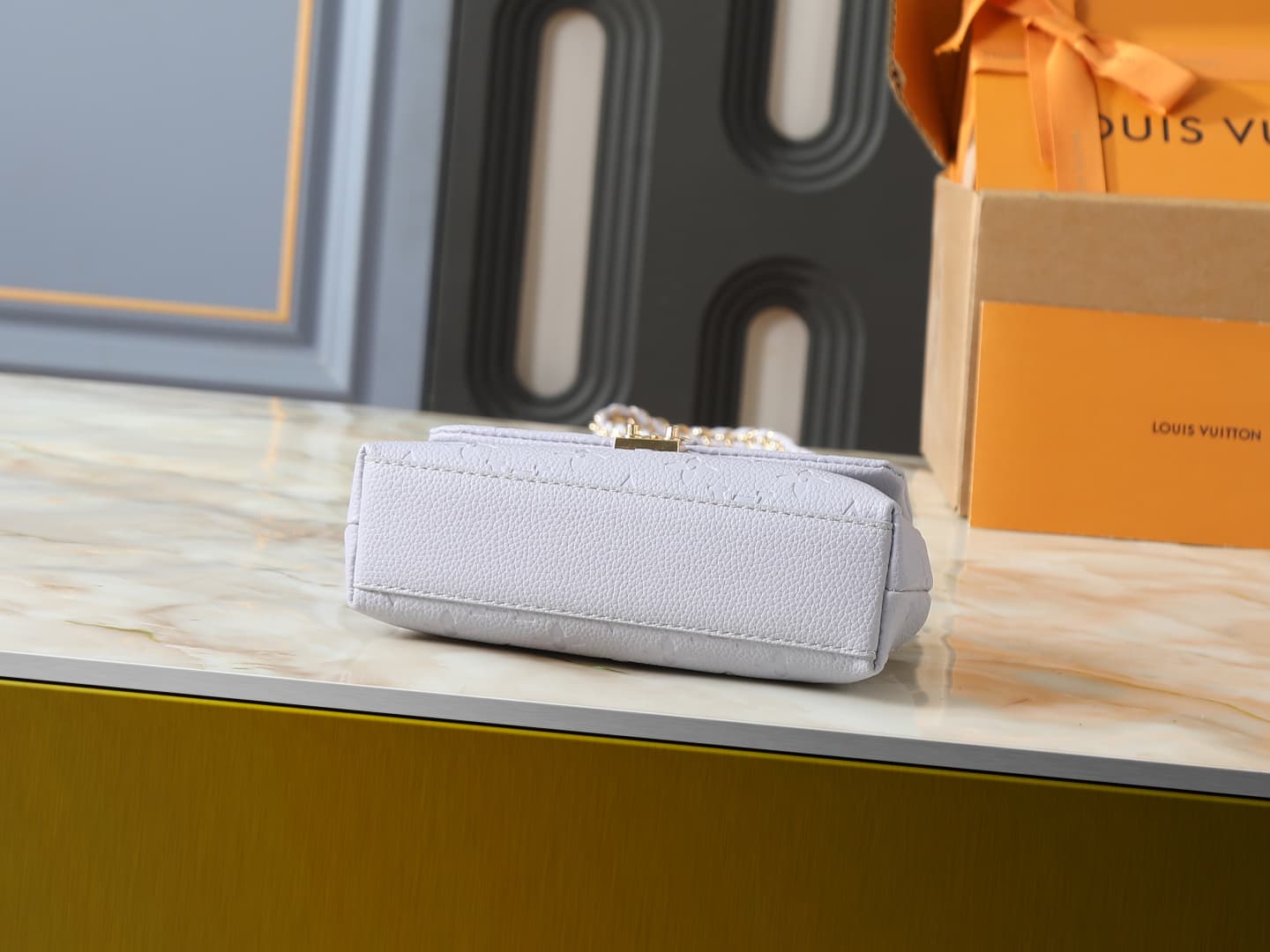 C5151 💰 Upgrade from the original M27034, M25596, M13796, M12145, M12144, and M12211. The Nano Madeleine handbag features a new season of dreamy colors, allowing easy styling in various ways. The classic Monogram Empreinte leather body is paired with the  — image 4