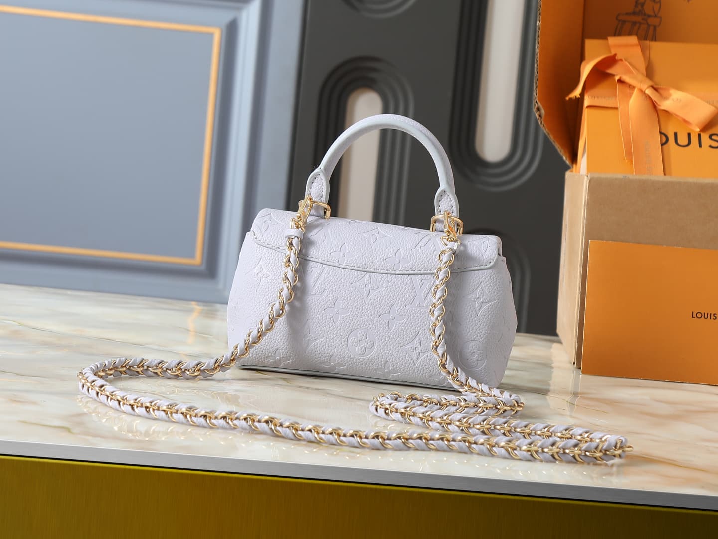 C5151 💰 Upgrade from the original M27034, M25596, M13796, M12145, M12144, and M12211. The Nano Madeleine handbag features a new season of dreamy colors, allowing easy styling in various ways. The classic Monogram Empreinte leather body is paired with the  — image 3