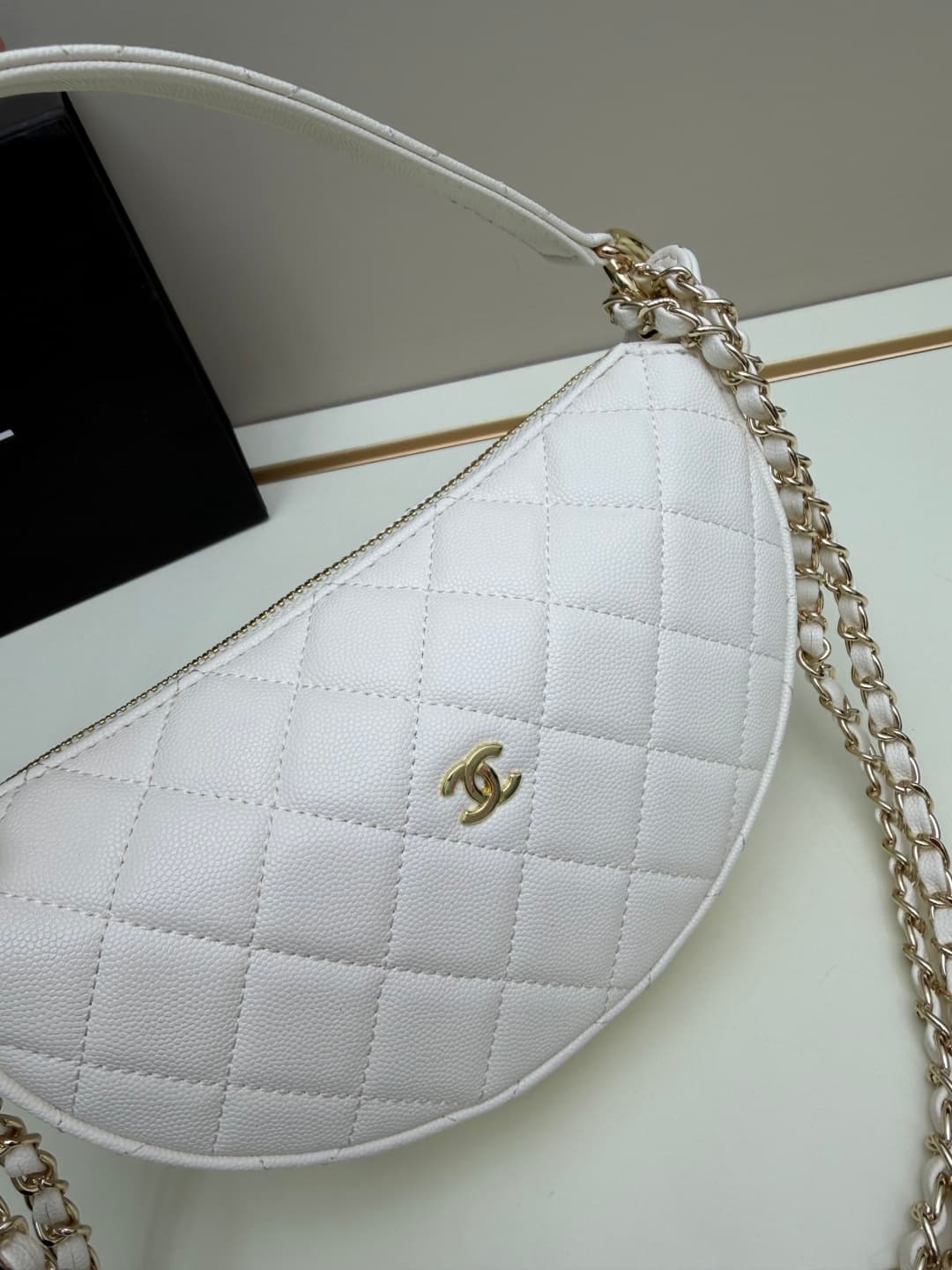 C684 Chanel 26 is a new underarm bag, shaped like a crescent. It’s very lightweight and can be carried across the shoulder. Leather made from grainy cowhide is considered one of the most durable materials used by Chanel; it doesn’t tear easily. However, t — image 4