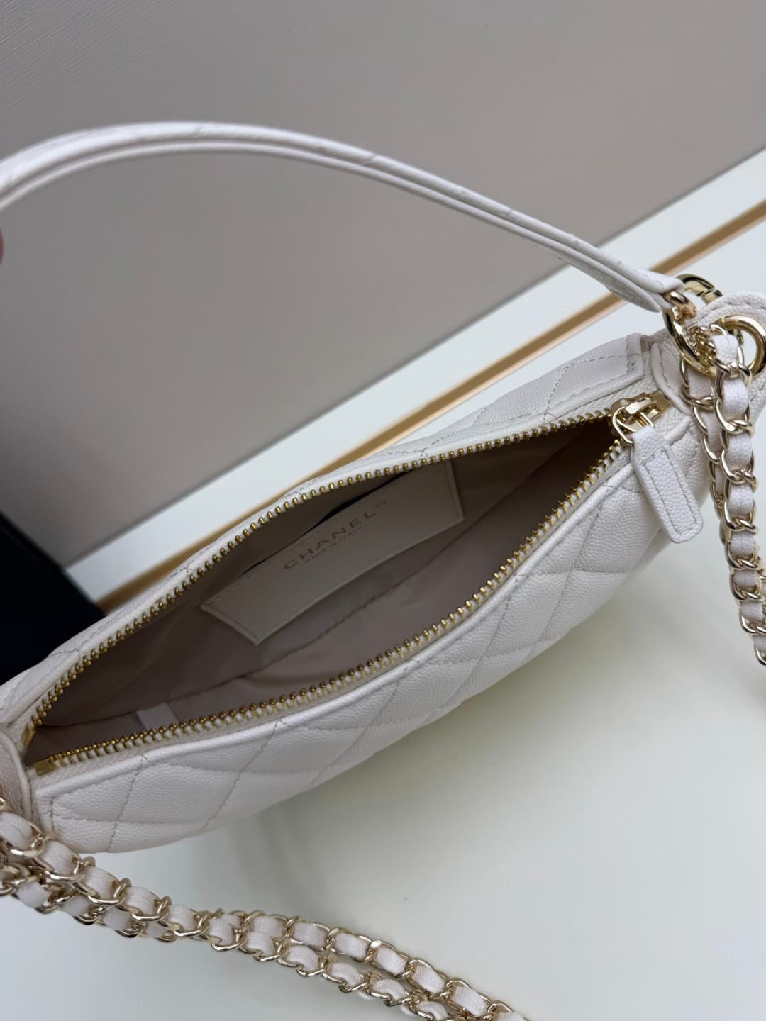 C684 Chanel 26 is a new underarm bag, shaped like a crescent. It’s very lightweight and can be carried across the shoulder. Leather made from grainy cowhide is considered one of the most durable materials used by Chanel; it doesn’t tear easily. However, t — image 7