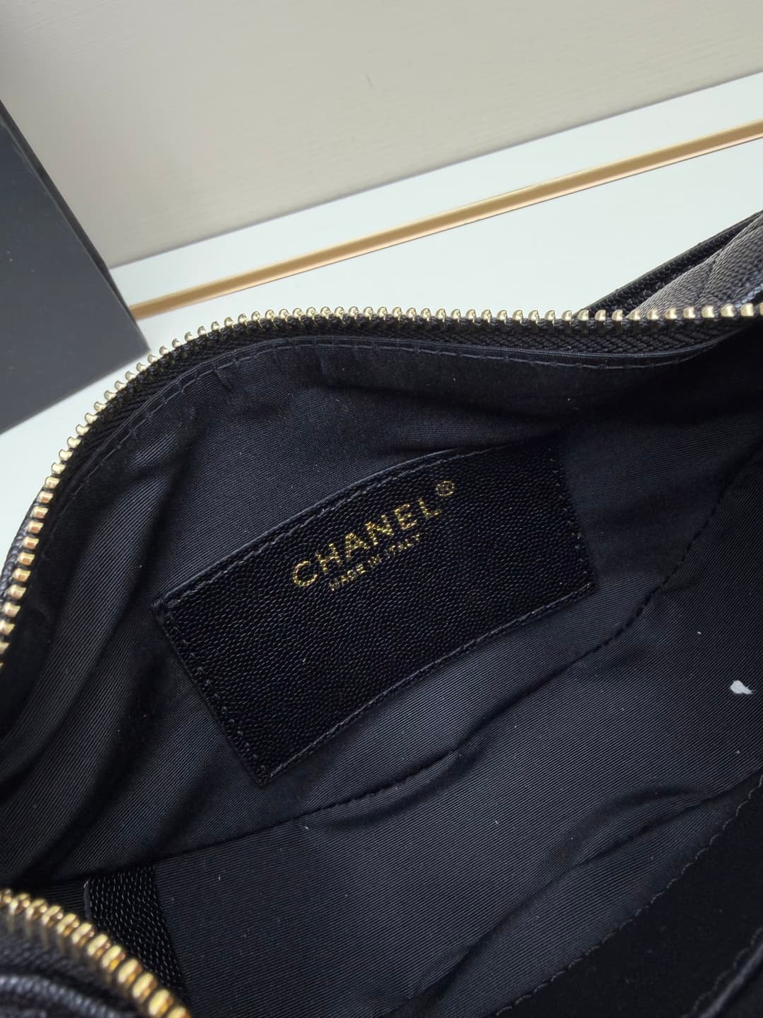 C682 Chanel 26 is a new underarm bag, with a crescent-shaped design. It’s very lightweight and can be carried across the shoulder. Leather made from grainy cowhide is considered one of the most durable materials used by Chanel; it doesn’t wear out easily. — image 8