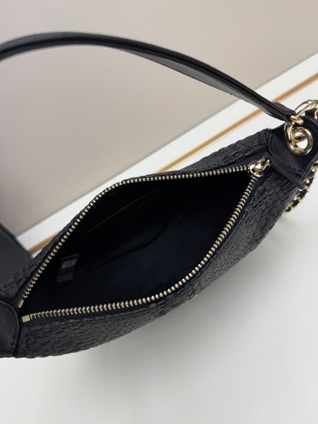 C679 Chanel 26 is a new underarm bag, shaped like a crescent. It’s very lightweight and can be carried across the shoulder. Leather made from grainy cowhide is considered one of the most durable materials used by Chanel; it doesn’t wear out easily. Howeve — image 7