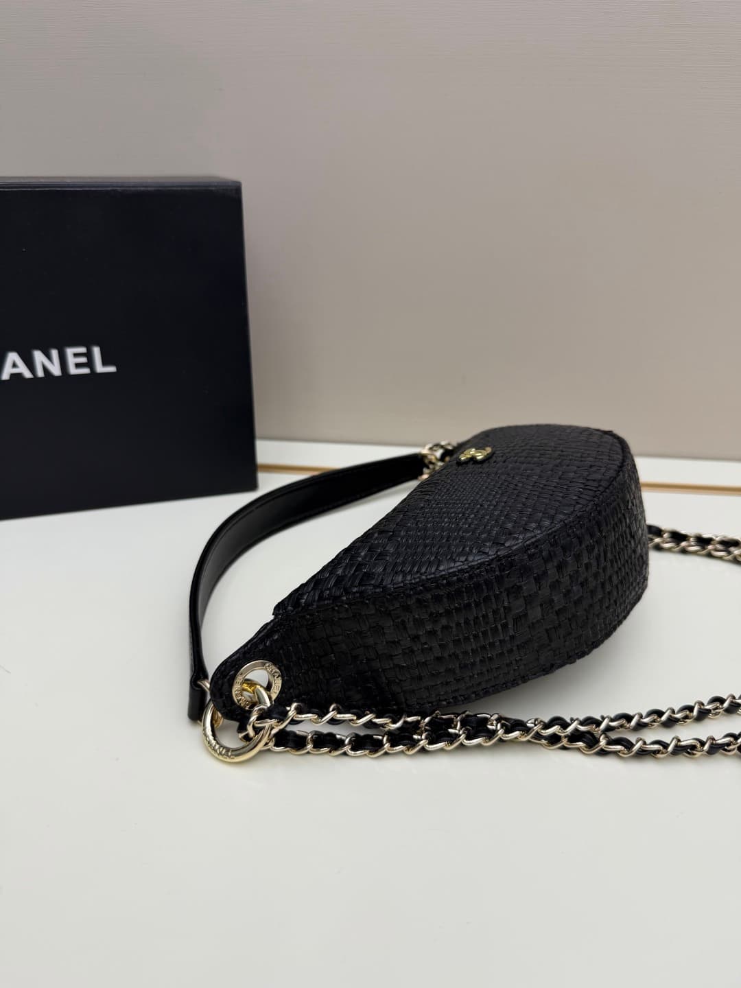 C679 Chanel 26 is a new underarm bag, shaped like a crescent. It’s very lightweight and can be carried across the shoulder. Leather made from grainy cowhide is considered one of the most durable materials used by Chanel; it doesn’t wear out easily. Howeve — image 2