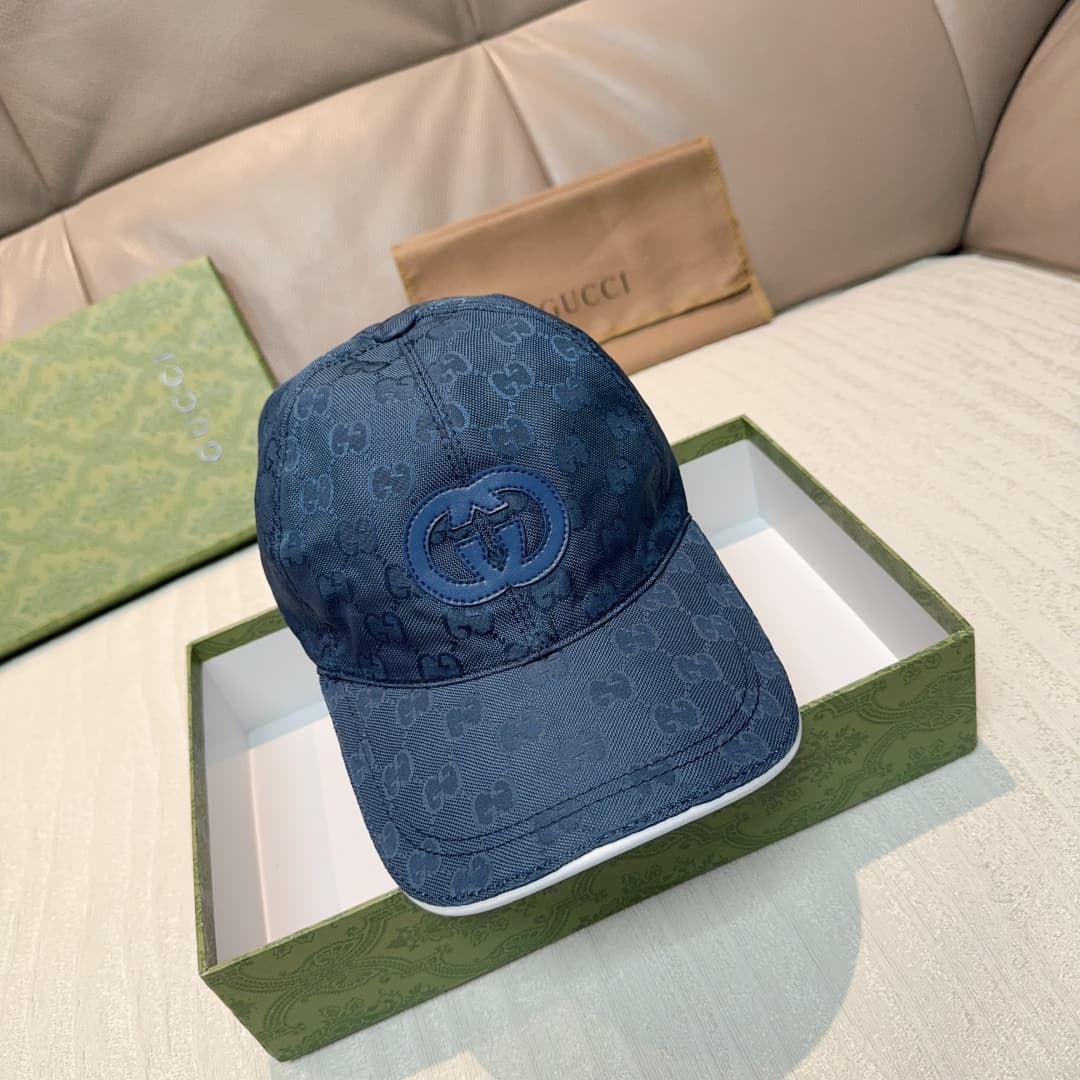 C29824 Gucci 2025 Early Autumn Collection presents a variety of energetic accessories. This baseball cap is crafted with GG nylon, adorned with interlocking G embroidery patches, bringing a unique and distinctive touch. — image 3