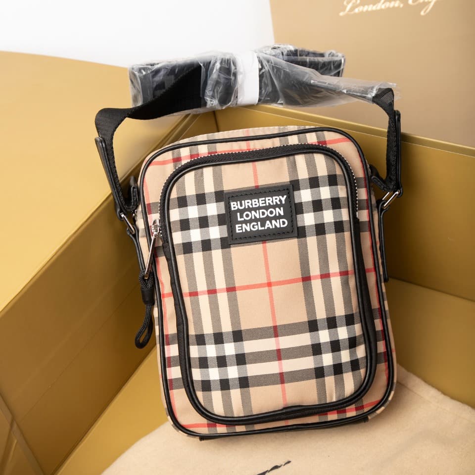 C80 280.00 B-family 1831 – a latest model, elegantly designed crossbody bag. It features checkered patterns on cotton panels, along with smooth leather trim. The design includes adjustable net nylon straps, adjustable crossbody straps, one zipper pocket;  — image 2