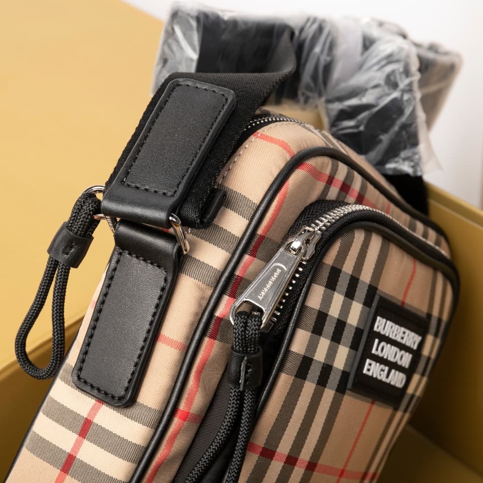 C80 280.00 B-family 1831 – a latest model, elegantly designed crossbody bag. It features checkered patterns on cotton panels, along with smooth leather trim. The design includes adjustable net nylon straps, adjustable crossbody straps, one zipper pocket;  — image 5