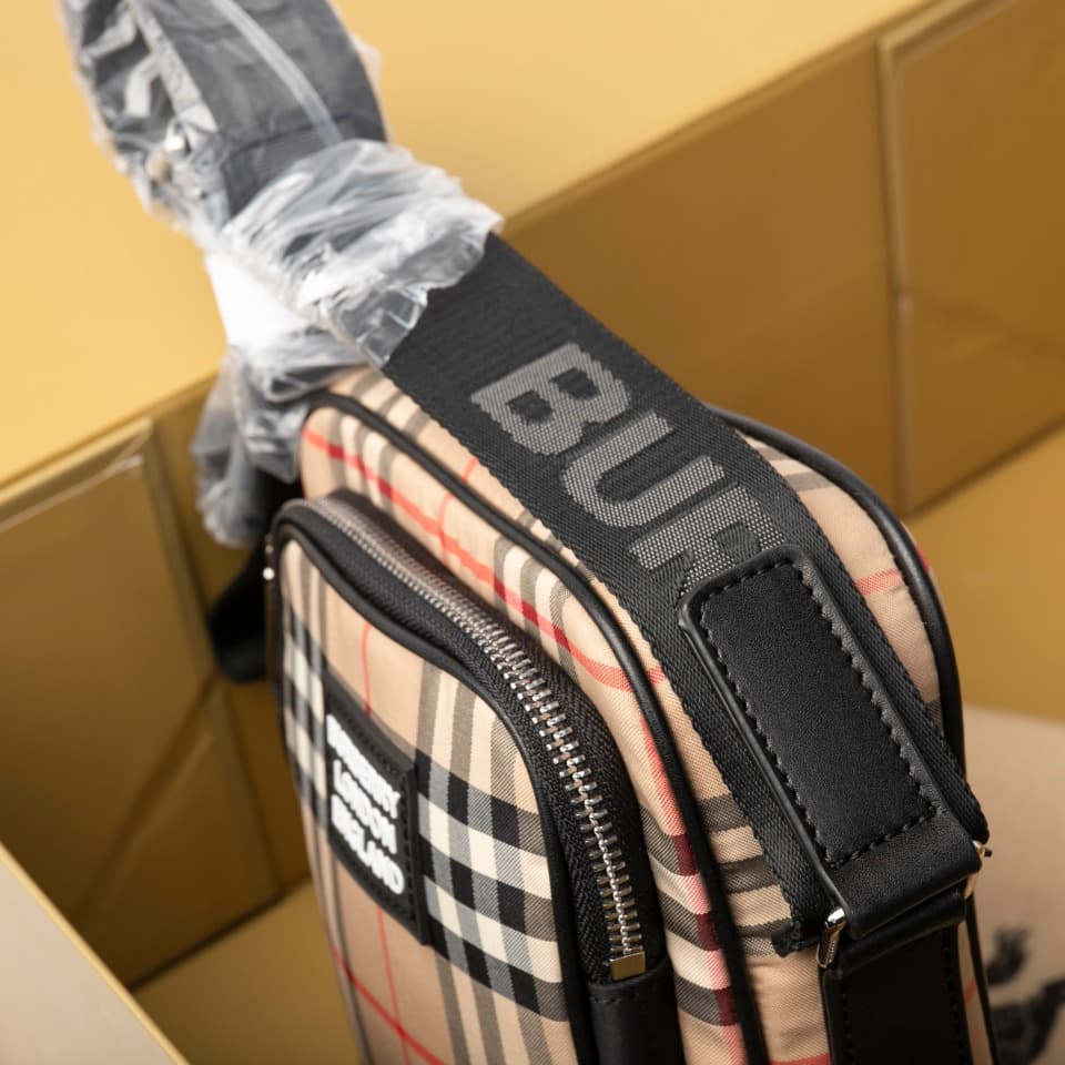 C80 280.00 B-family 1831 – a latest model, elegantly designed crossbody bag. It features checkered patterns on cotton panels, along with smooth leather trim. The design includes adjustable net nylon straps, adjustable crossbody straps, one zipper pocket;  — image 7