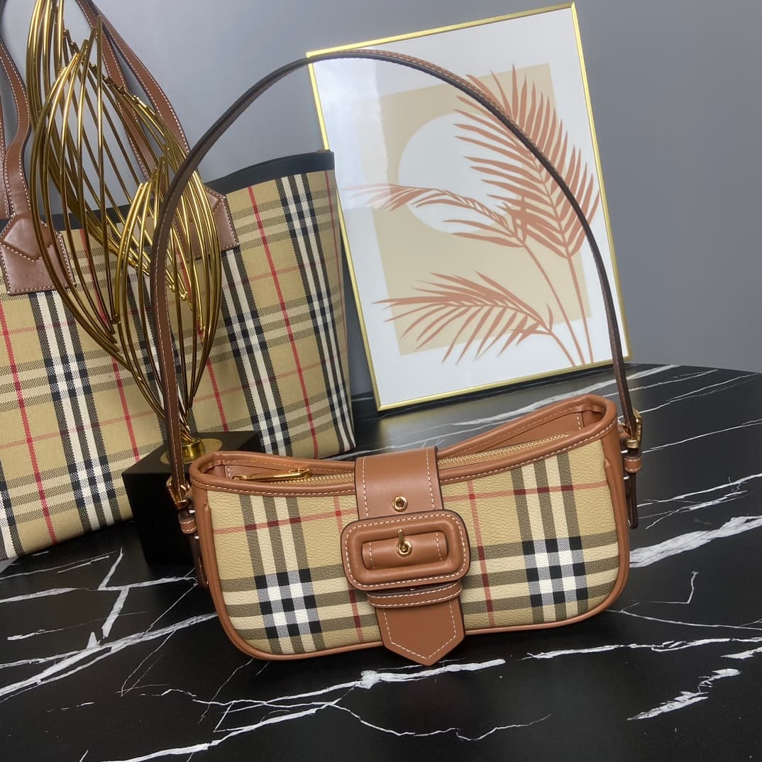 C19 B brand's latest Italian-made bag style, decorated with Burberry plaid pattern. Standout buckle belt design inspired by the brand's iconic Trench coat. Model 3308, sizes: 26 x 6 x 12 , — image 1