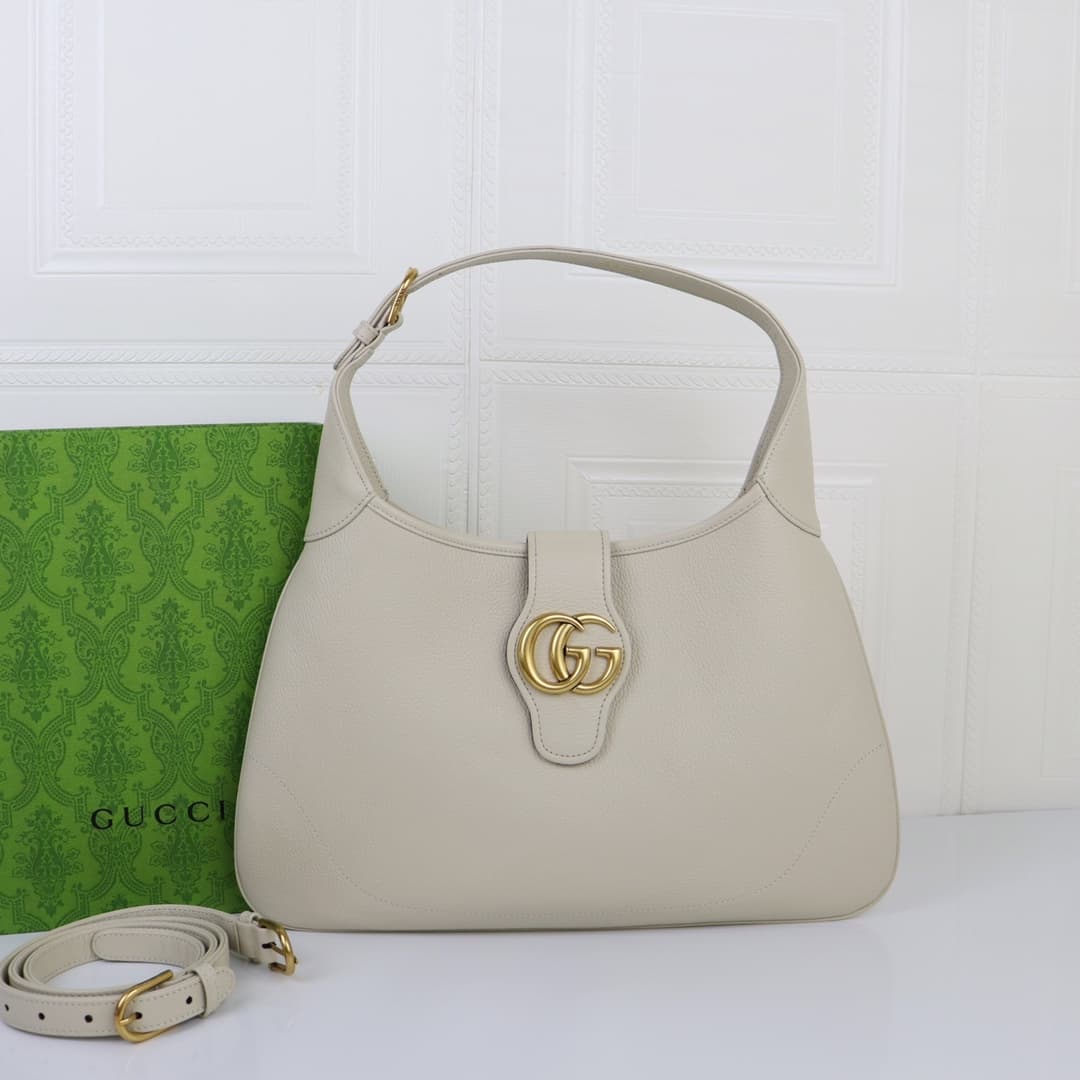 C4037 🌟 The “Aphrodite Collection” medium crescent-shaped shoulder bag. The “GucciCosmogonie” collection is presented at the historic Monte Carlo in Italy. On the runway, aesthetic elements from different times and locations blend together, connecting the — image 1