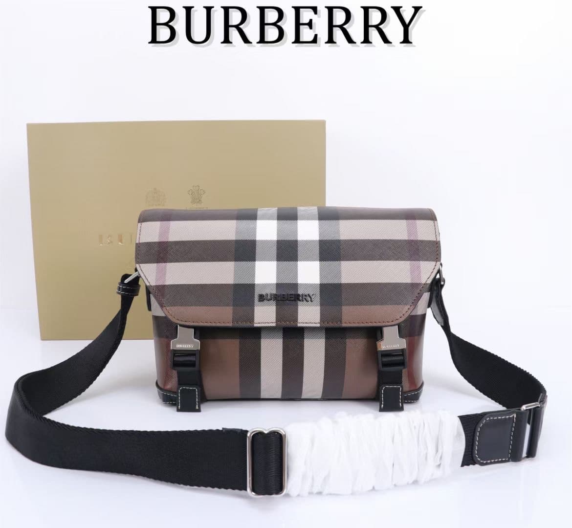 C142 The Balmain messenger bag features a structured design, with a brand’s charcoal-gray pattern. It is decorated with smooth leather details and an emblem design. There is a zipper pocket for storing small items. The adjustable shoulder strap ensures a — image 1
