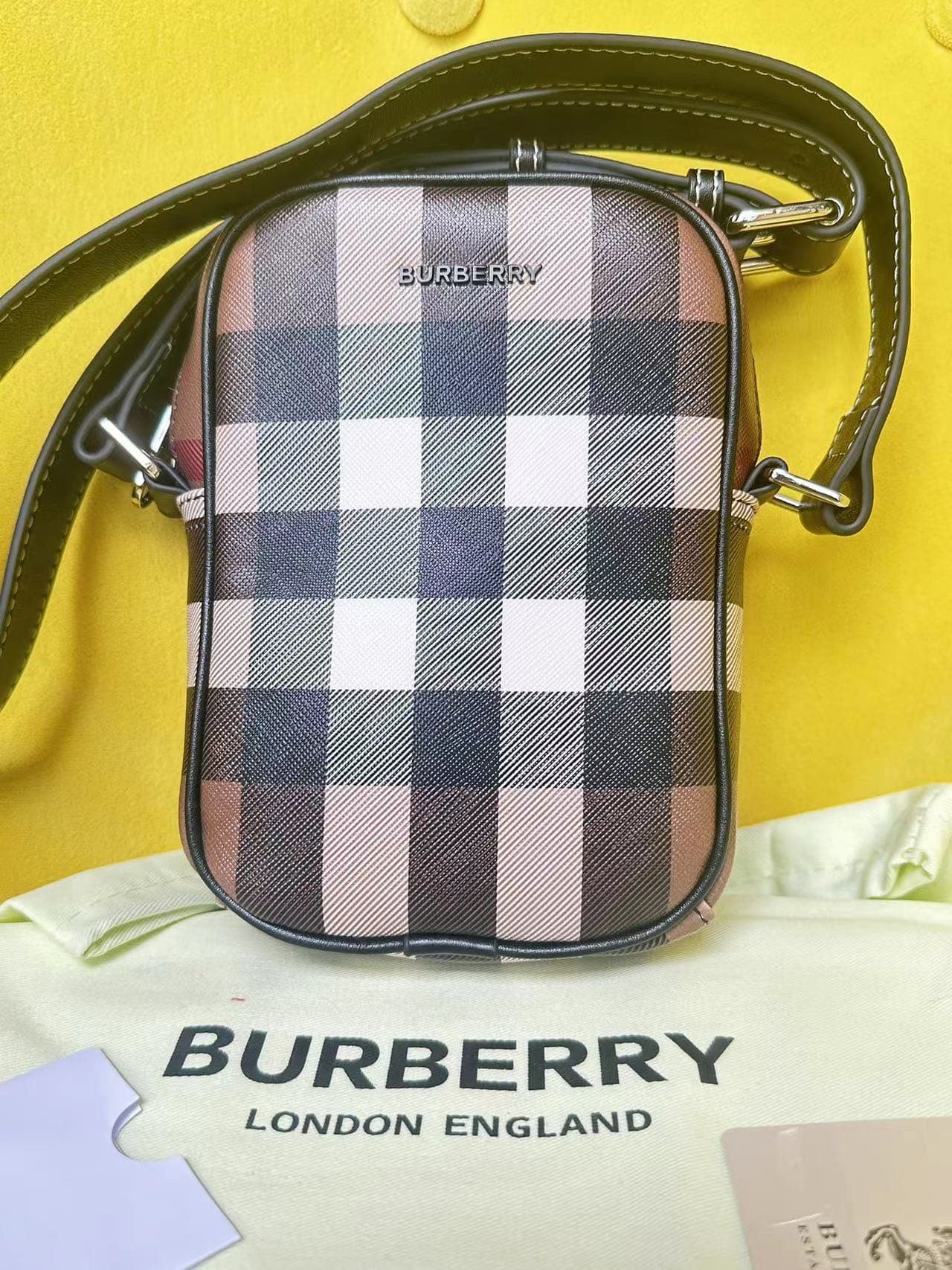 C146 Burberry’s elegant bags, adorned with Burberry check patterns and the brand logo. They feature adjustable leather shoulder straps. The bio-based materials are derived from renewable resources such as plants and castor oil. Available in sizes 12, 4, 5 — image 1