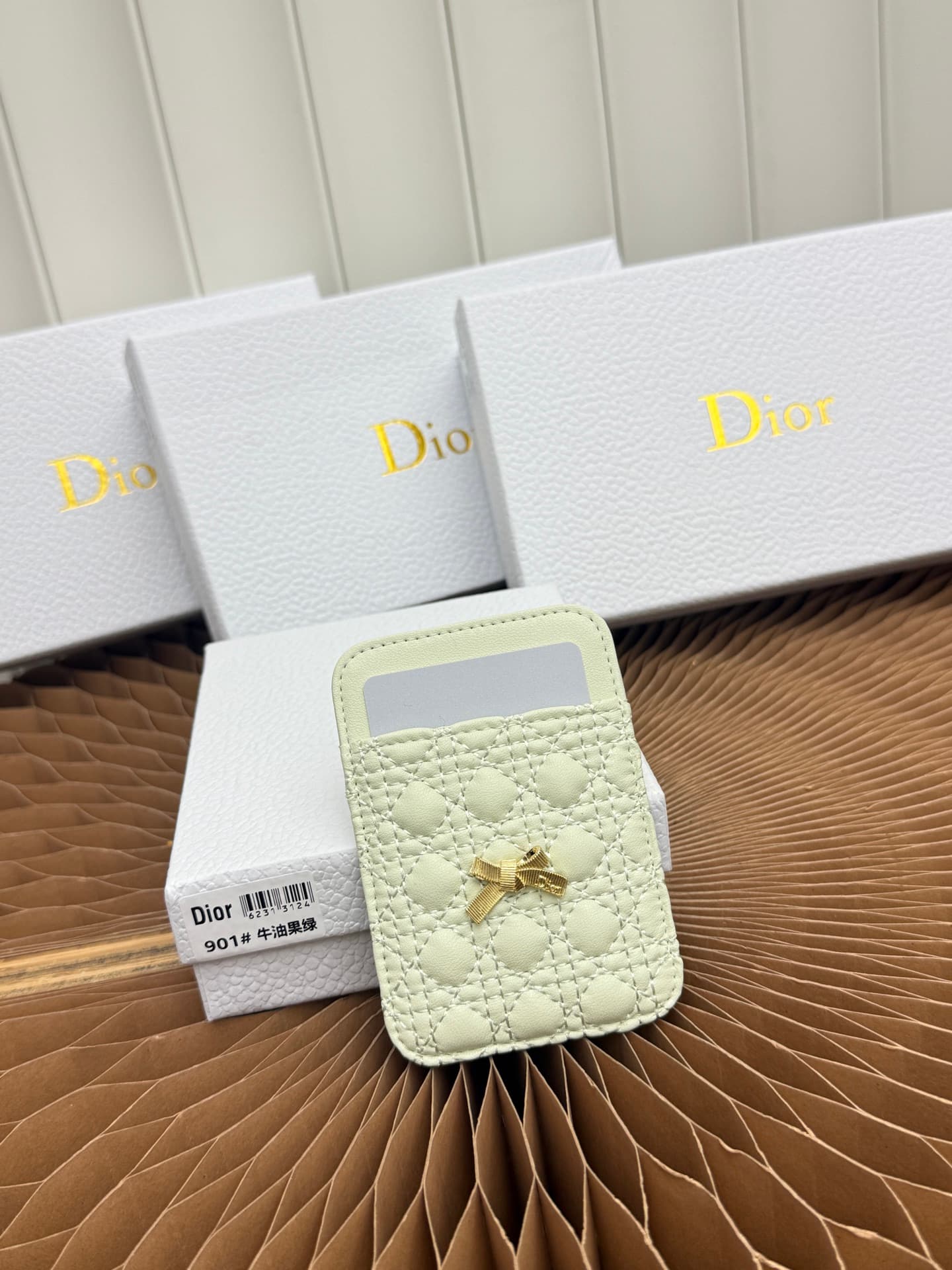 C393 This Baby Bow magnet card case is beautifully designed and practical. The black mini pattern with twill texture, along with the delicate bow ties, offer a clever new interpretation of the classic brand’s theme. This elegant card case can be used in c — image 1