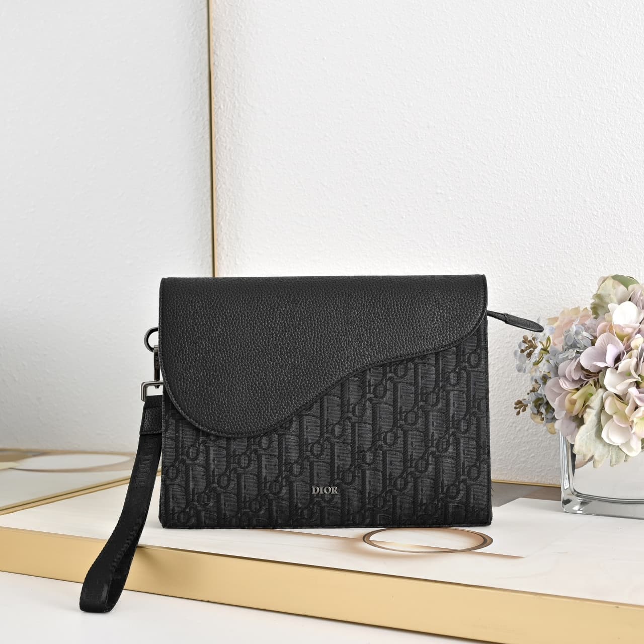 C1819 The A5 triangle-handbag is a new flagship product. It is crafted from beige and black Oblique print fabric, along with black grain leather for the flap design. The spacious zipper compartment can hold a phone, and there are also card slots. A detach — image 1