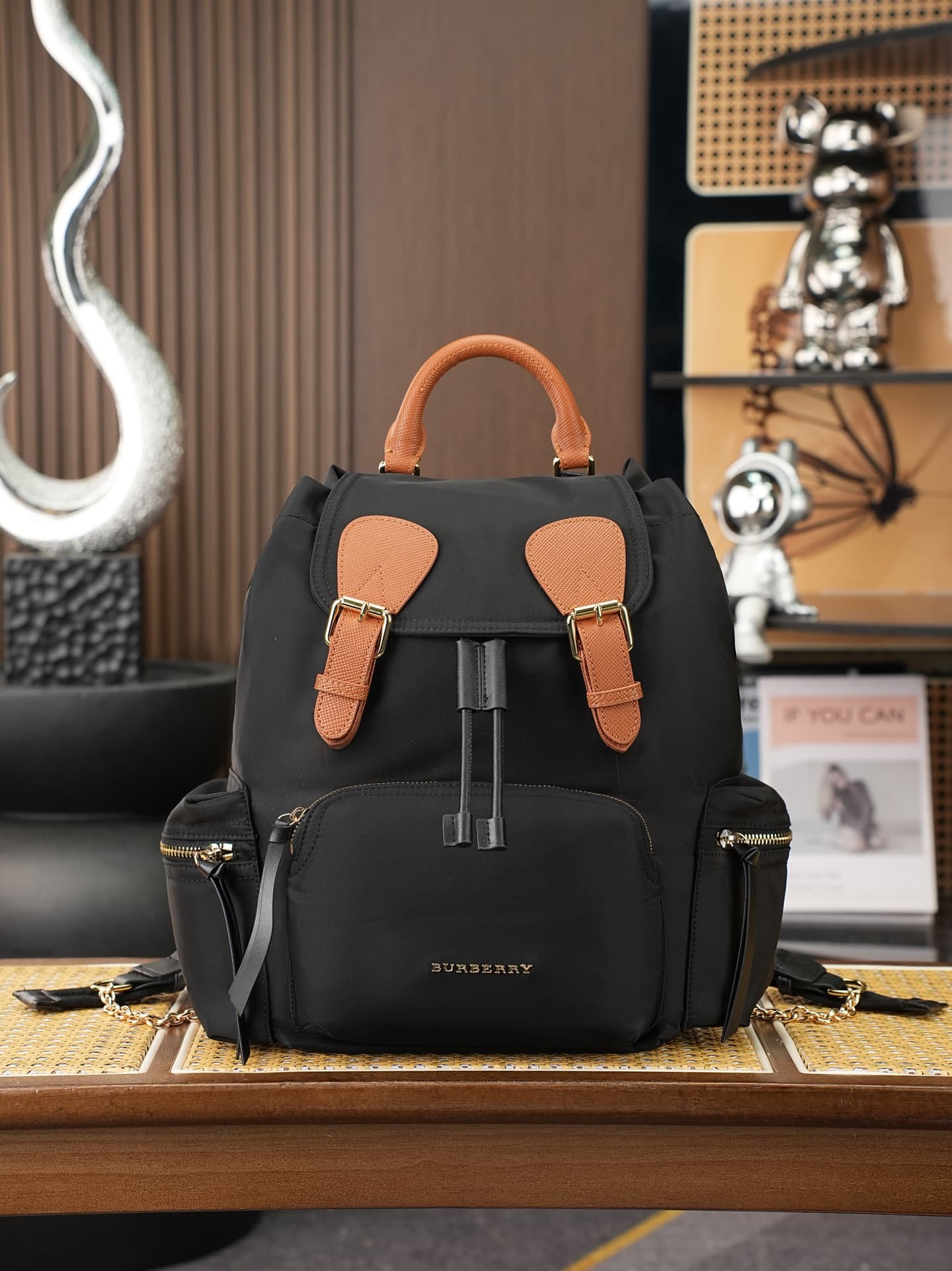C90 The model “The Rucksack” from Bhome is a key accessory for fashion shows. It is lightweight and rainproof. The shoulder straps feature a comfortable padded design, along with beautiful metal chain decorations. The model number is 8304 — image 1