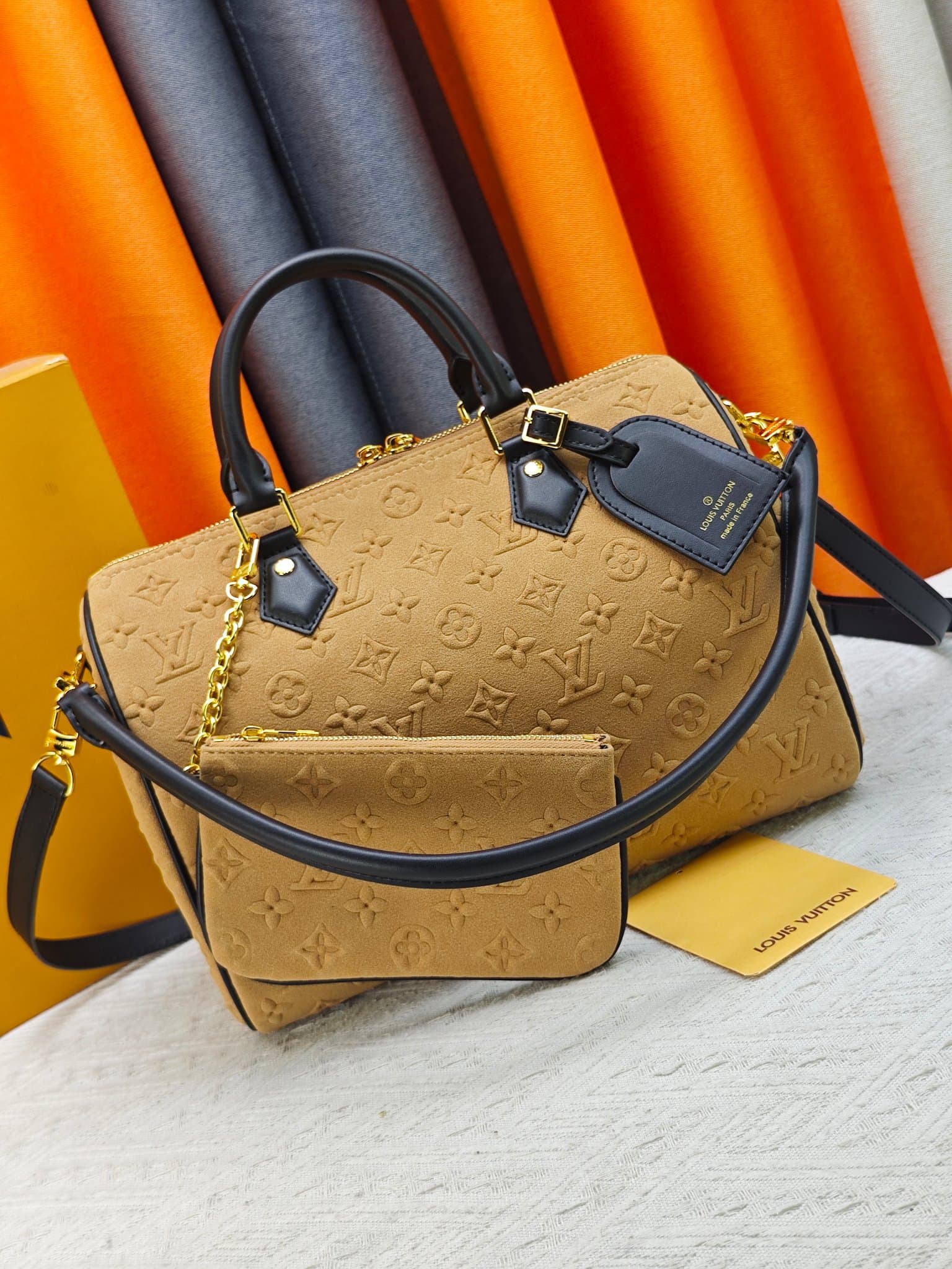 C5036 💰 M13332 M13344 Apricot-colored embossed suede, for shows. This model, Speedy Soft 30, is from LV Travels With Grace Coddlington. — image 1