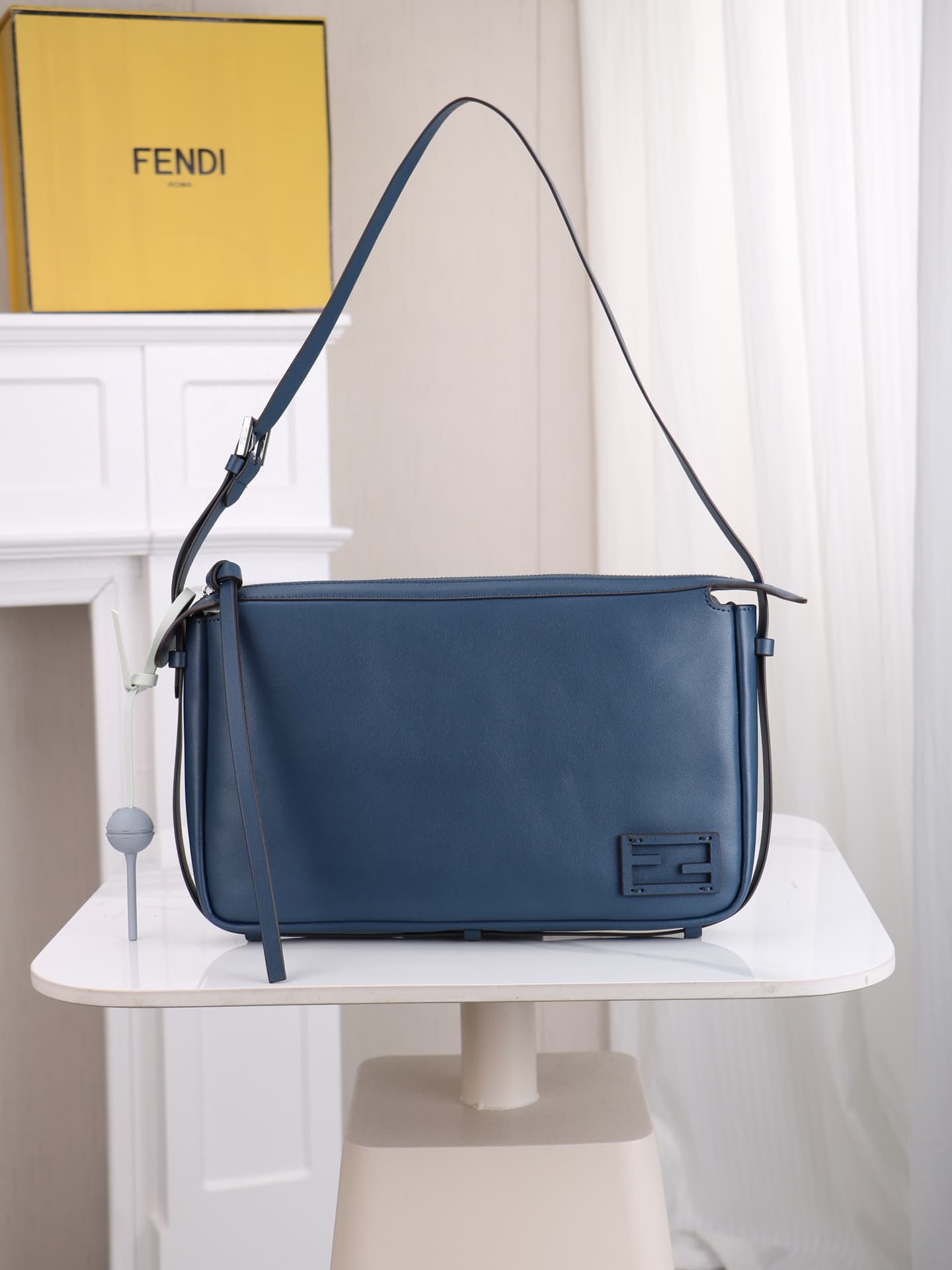 C2872 The medium-sized 4409 Simply FENDI handbag is a soft crossbody bag that was showcased at the autumn and winter fashion shows. It draws its inspiration from the classic design styles of 20 and 90 from the early years of that era; thus, it was named a — image 1