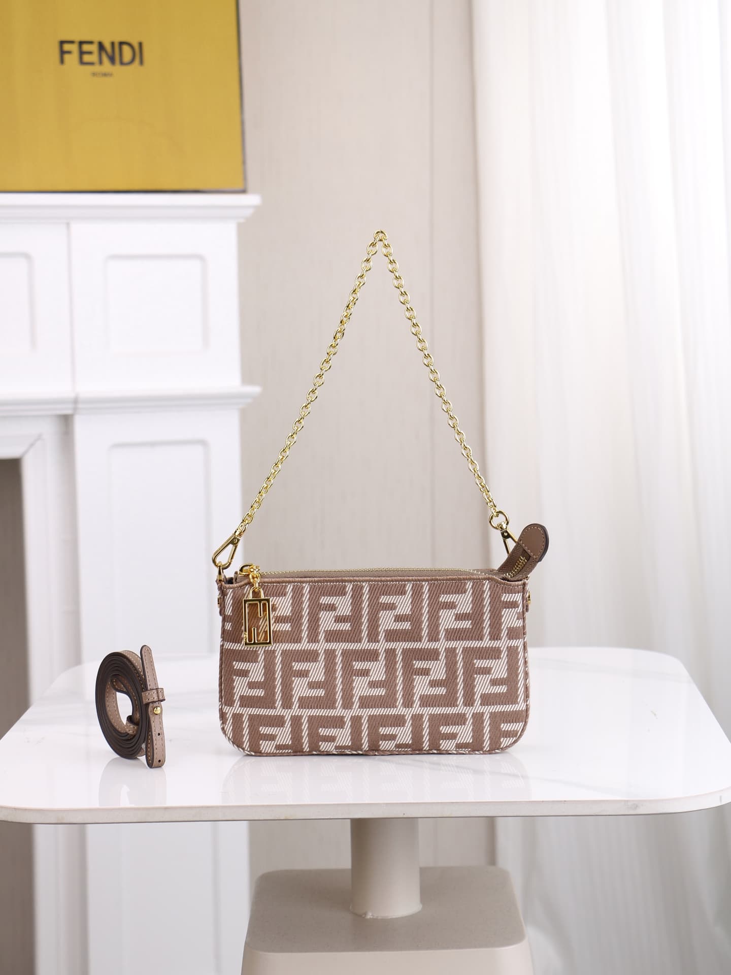 C2861 Model 7717 Baguette handbag. Made of denim print material, with classic double F logos. Features a detachable thin chain and long shoulder strap. Closes with zippers; the zipper pulls have the distinctive FF pattern. It’s small and delicate, perfect — image 1