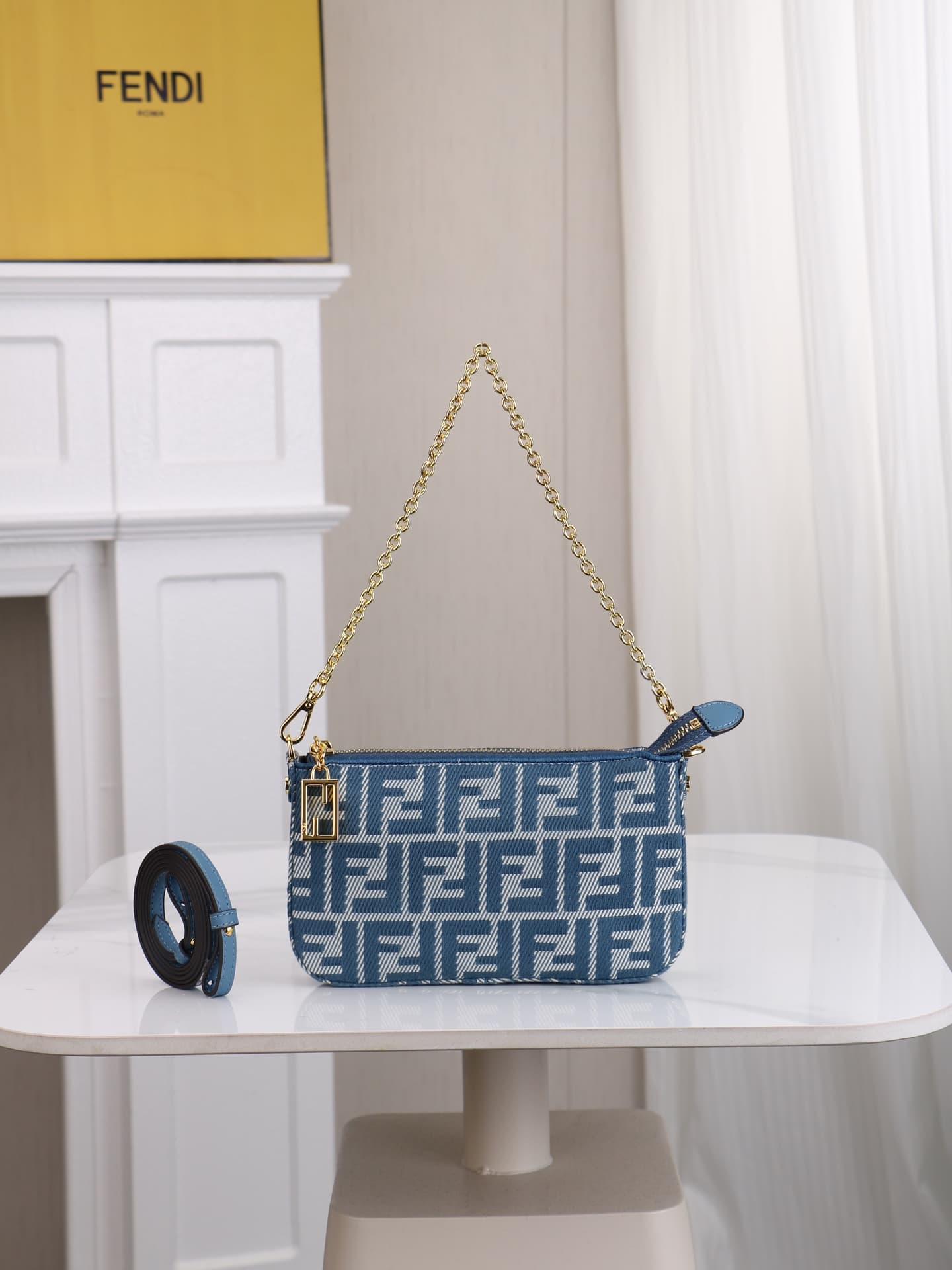C2863 Model 7717 Baguette handbag. Made of denim print material, with classic double F logos. Features a detachable thin chain and long shoulder strap. Closes with zipper; the zipper pull has the distinctive FF pattern. It’s compact and elegant, perfect f — image 1