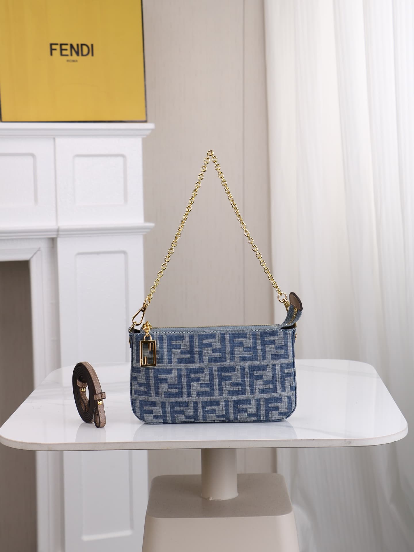 C2859 Model 7717 Baguette handbag. Made of denim print material, with classic double F logos. Features detachable thin chains and long shoulder straps. Opened with zippers, and the zipper pulls have the distinctive FF pattern. It’s compact and elegant; pe — image 1