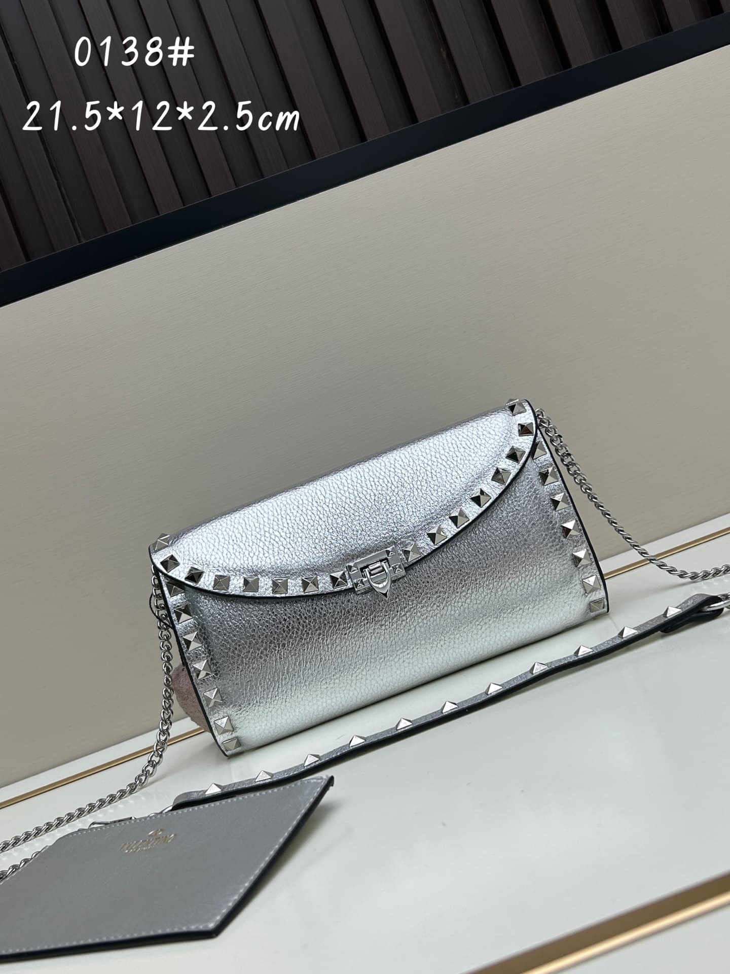 C8300 Garavani Rockstud Mini leather crossbody bag, featuring the iconic hook-clasp closure design — image 1