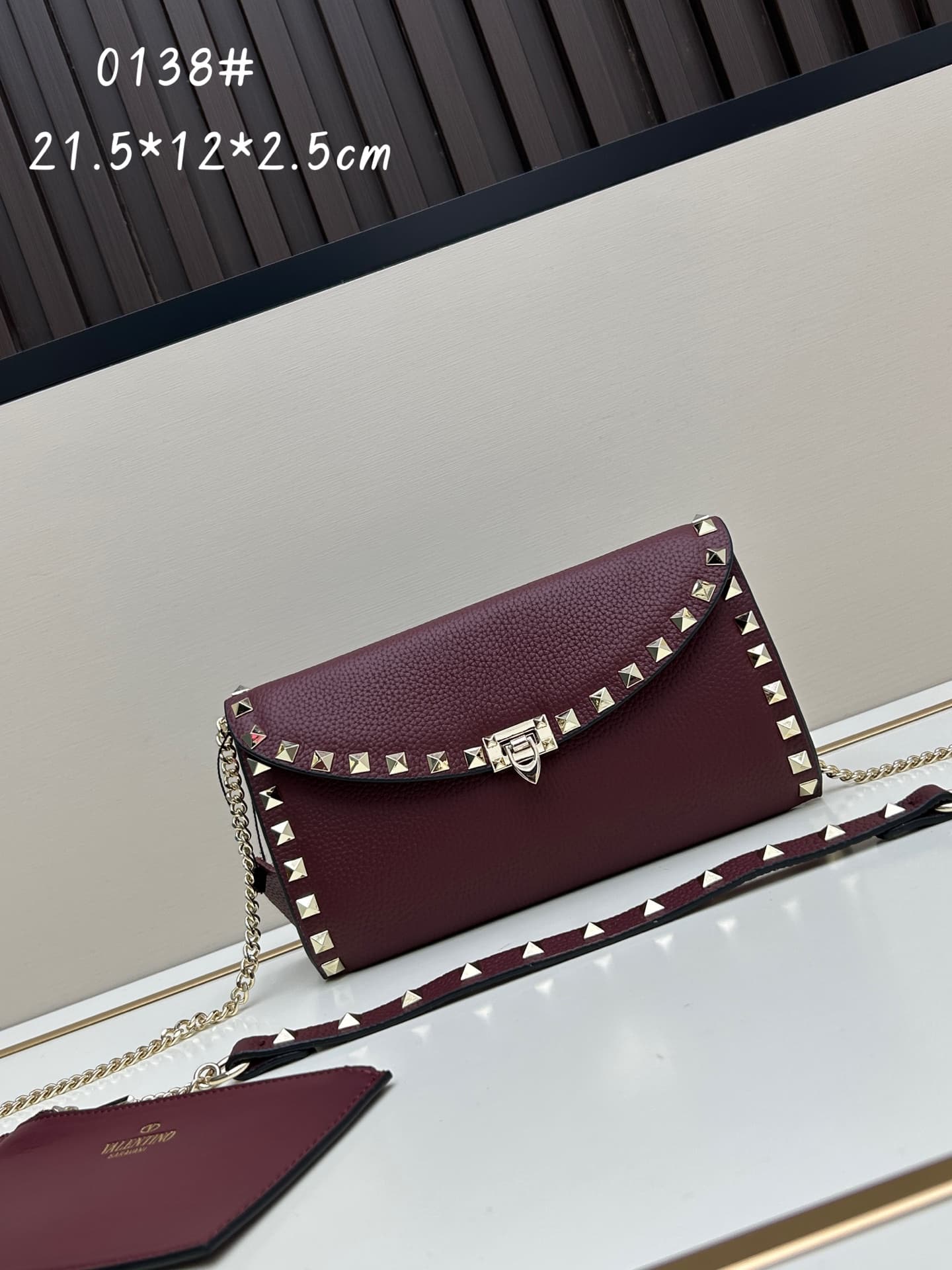 C8297 Garavani Rockstud Mini leather crossbody bag, featuring the iconic hook closure design — image 1