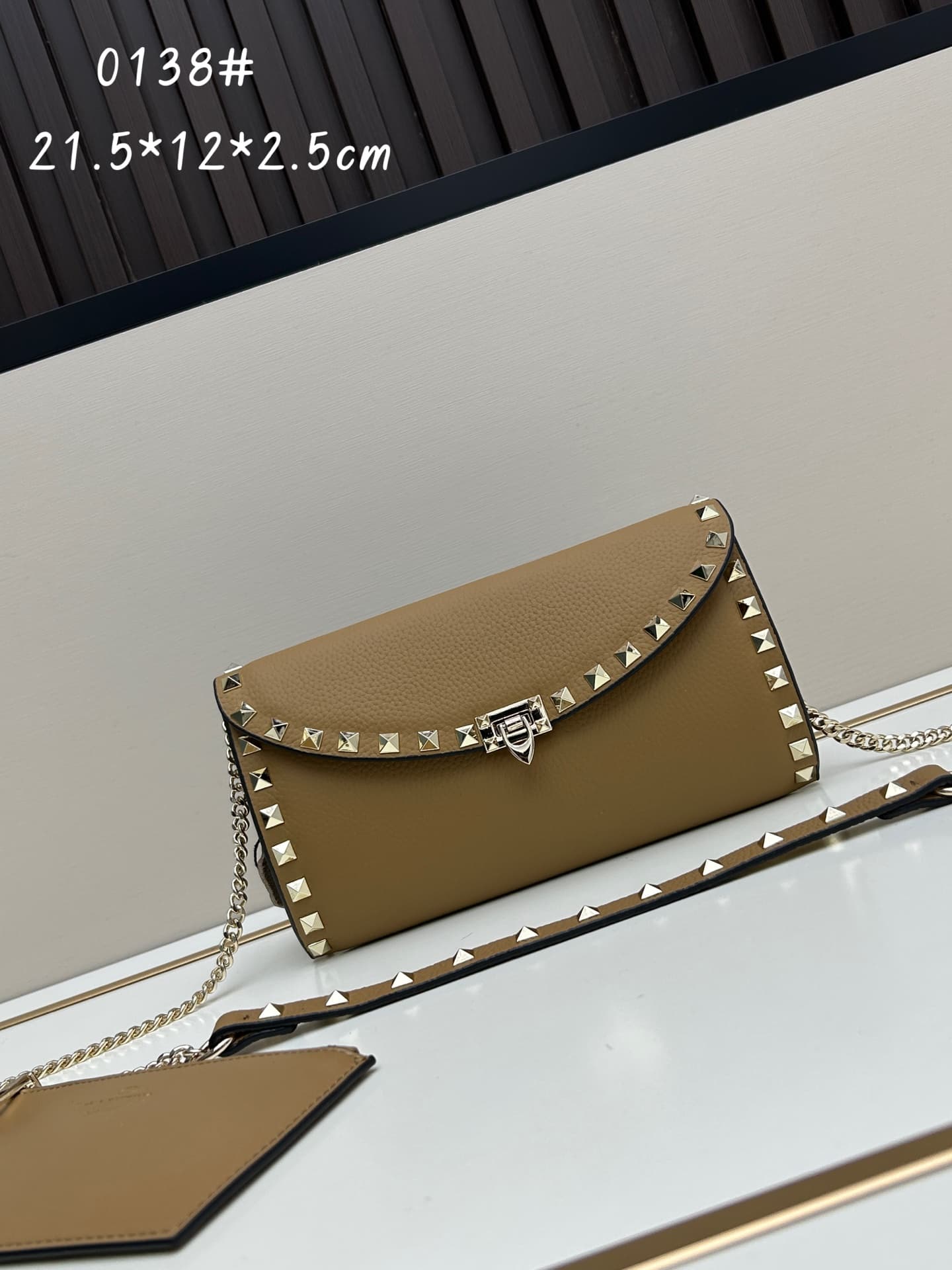 C8295 Garavani Rockstud Mini leather crossbody bag, featuring the iconic hook closure design — image 1