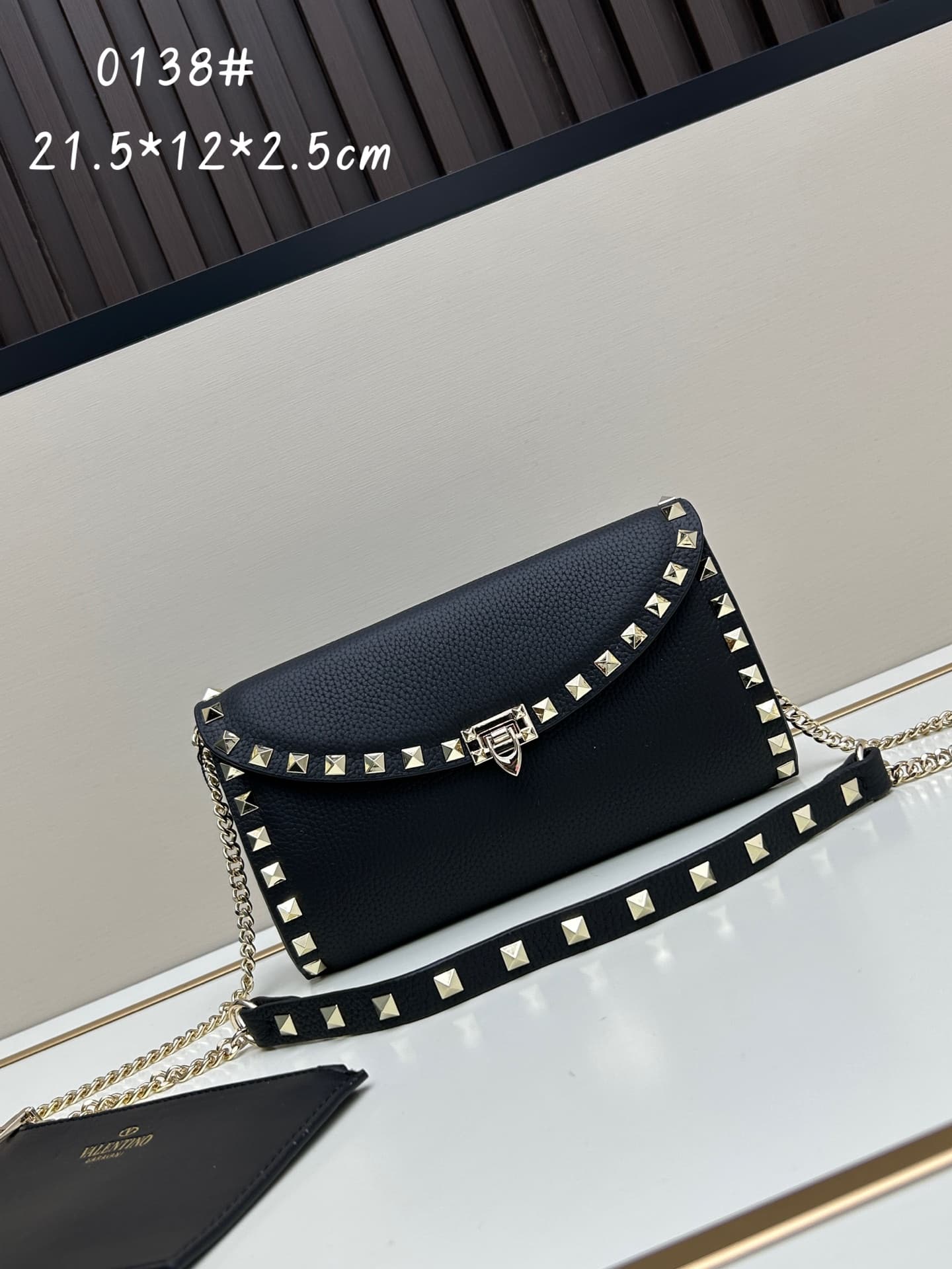 C8294 Garavani Rockstud Mini cowhide crossbody bag, featuring the iconic hook-clasp closure design — image 1