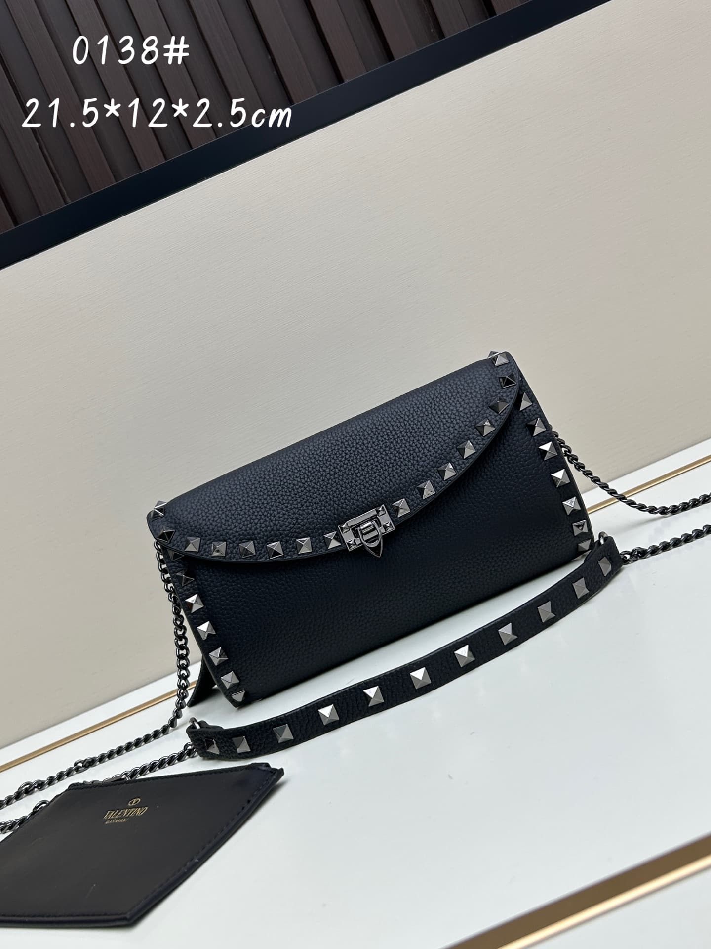 C8293 Garavani Rockstud Mini cowhide crossbody bag, featuring the iconic hook closure design — image 1