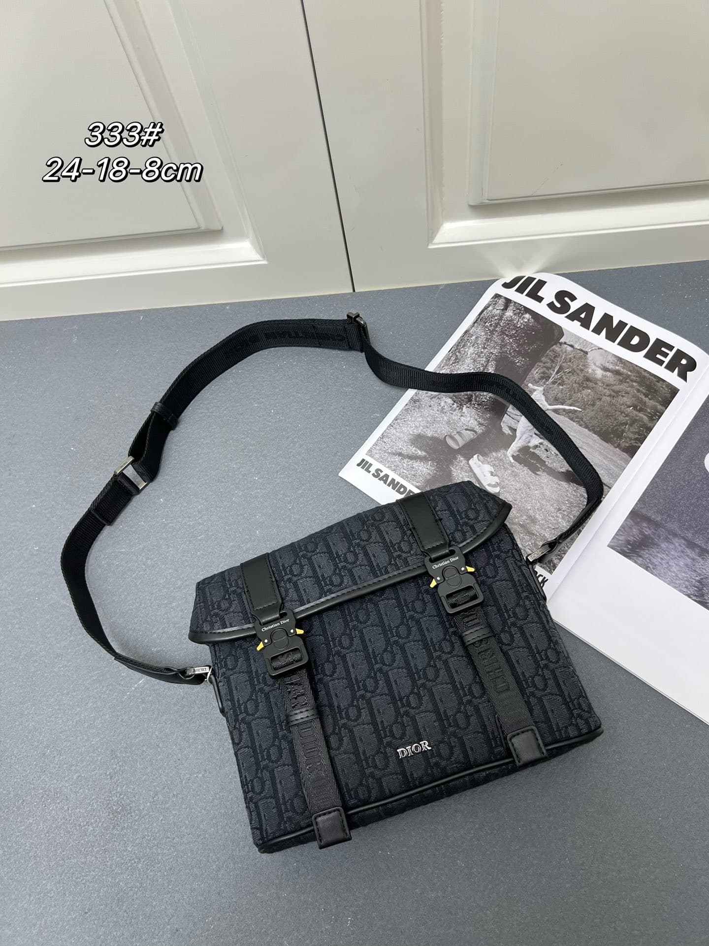 C1780 ¥ This messenger bag is a new product from the 2024 Autumn collection series. With its flap design, the modern and fashionable style perfectly highlights the high-end aesthetic, further enriching the Hit the Road series. The Gravity print effect on — image 1
