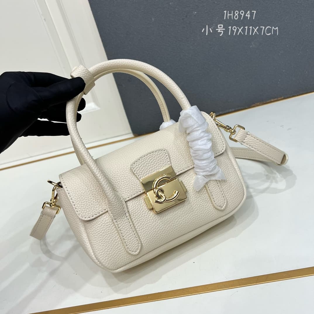 C8323 Small size, comes with a gift box. The new COCCINELLE Coconne crossbody bag is made of litchi-textured cowhide material. It can be worn on the hand or shoulder, offering a casual and stylish look, simple and elegant. — image 1