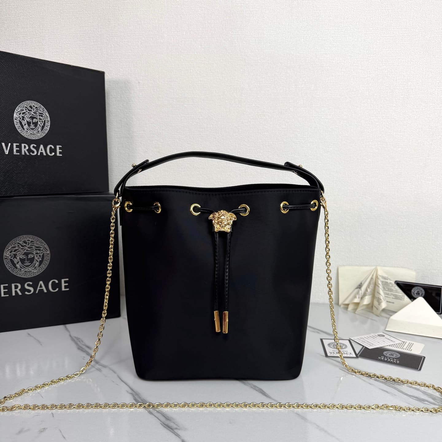 C8334 .2026 new model 🆕 available for sale. Versace mini women’s drawstring bucket bag, made of high-quality satin waterproof material. The large capacity is really impressive; it comes with long and short shoulder straps. — image 1