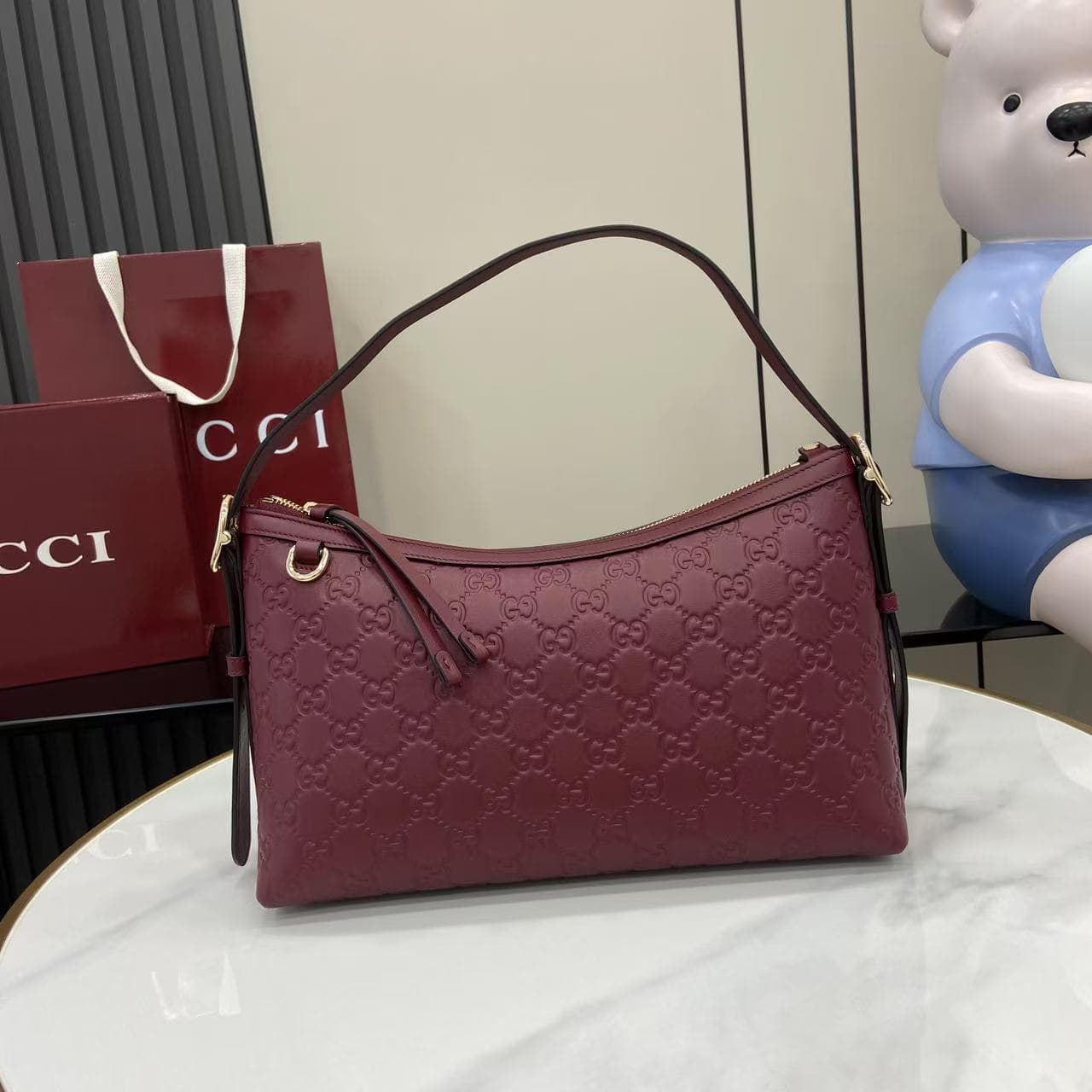 C4016 2025 Fall/Winter collection; GG Emblem series presents a fresh interpretation of the brand’s enduring elegance and exquisite craftsmanship. This shoulder bag is made from GG embossed leather, showcasing a delicate texture. — image 1