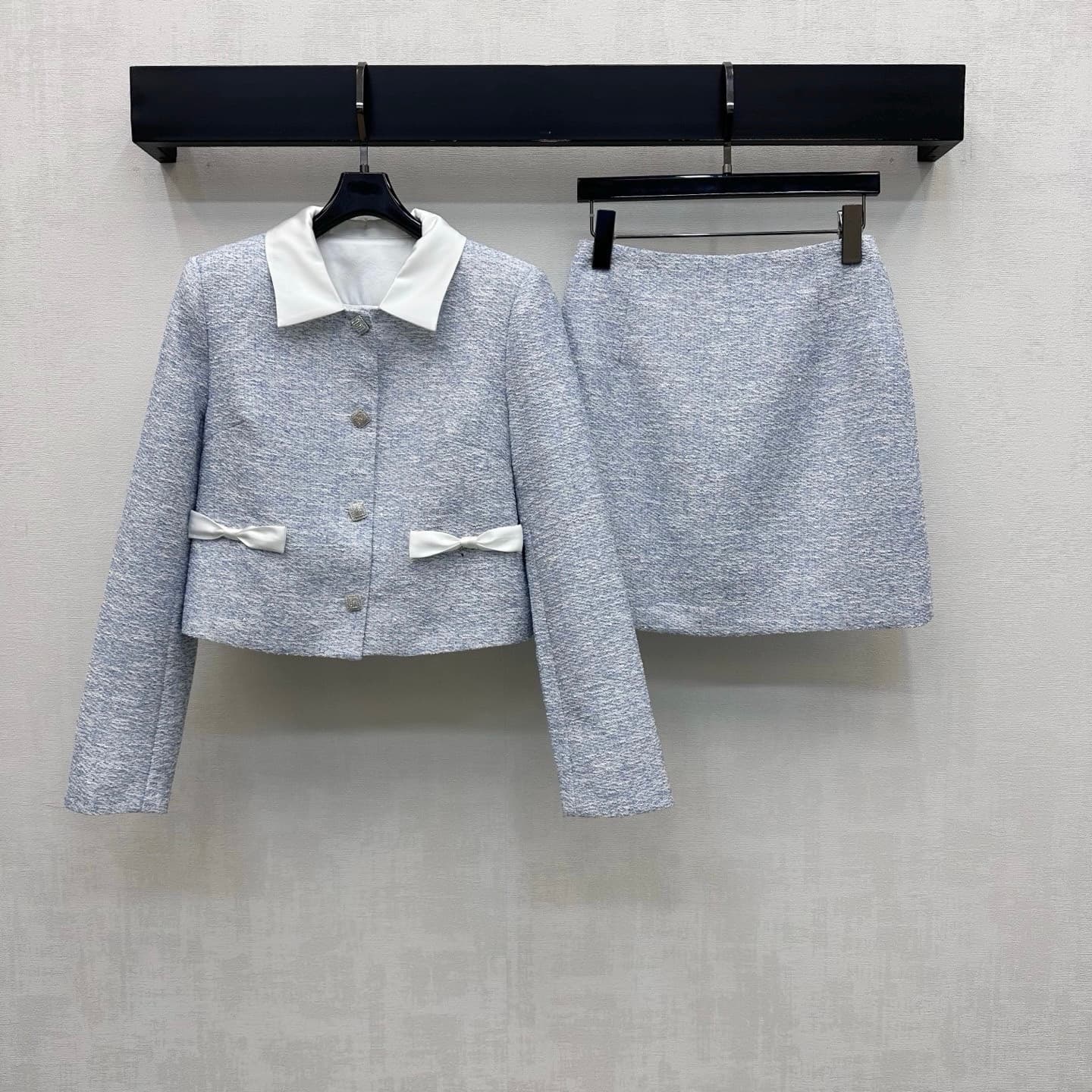 C19568 Chane*2026 new product launched. White silk bow tweed set for office workers. Customized YB imported mixed-colored tweed material with rich texture. Elegant and stylish design; featuring a contrasting white satin collared top and single-row stud bu — image 1